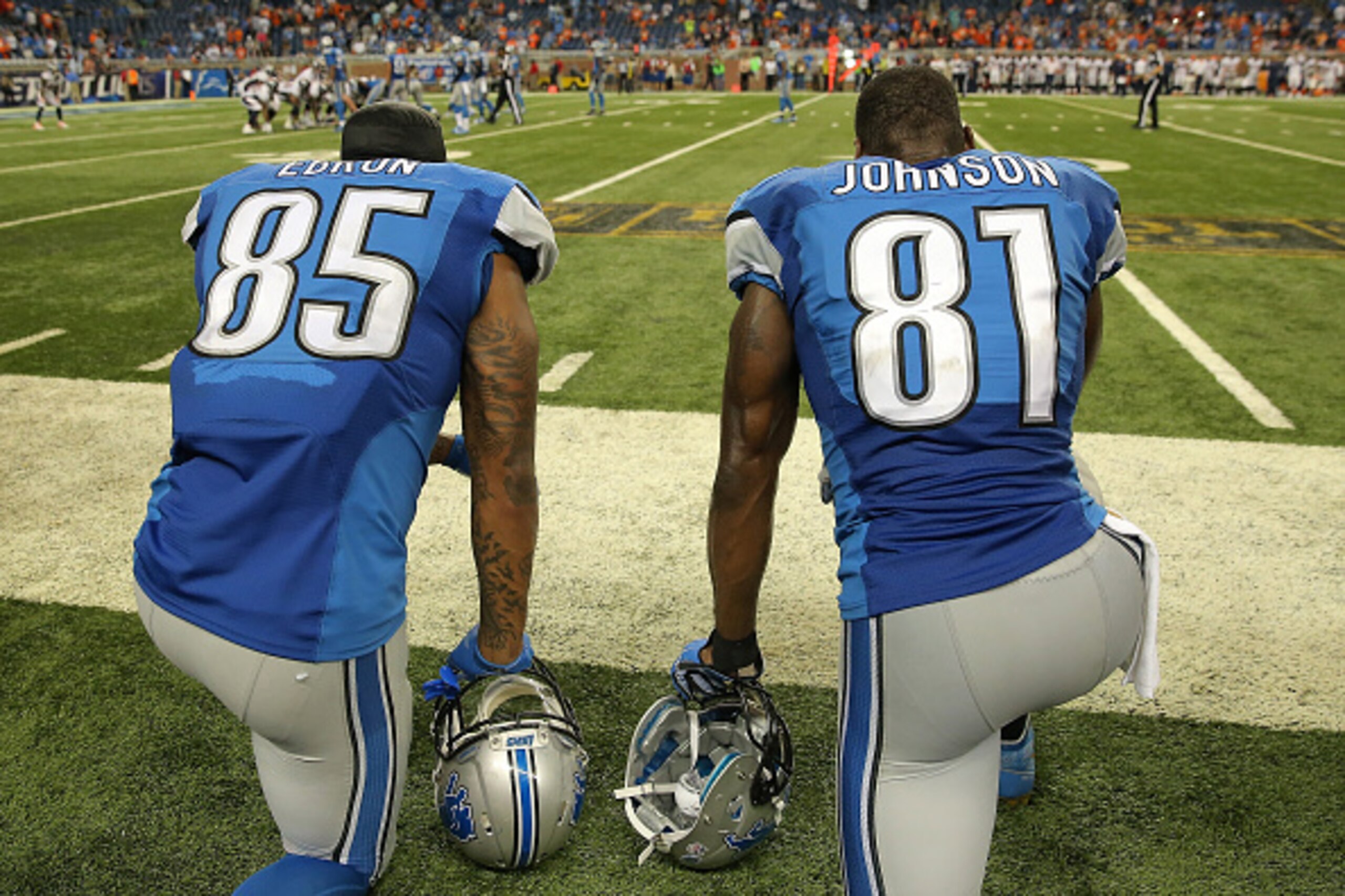 DETROIT, MI - SEPTEMBER 27:  Tight end Eric Ebron #85 and wide receiver Calvin Johnson #81 of the Detroit Lions looks on from the sidelines against the Denver Broncos at Ford Field on September 27, 2015 in Detroit, Michigan. The Broncos defeated the Lions