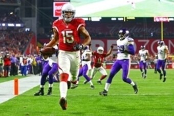 Dec 10, 2015; Glendale, AZ, USA; Arizona Cardinals wide receiver Michael Floyd (15) scores a touchdown in the second half against the Minnesota Vikings at University of Phoenix Stadium. The Cardinals defeated the Vikings 23-20. Mandatory Credit: Mark J. R