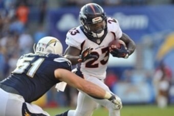 Dec 6, 2015; San Diego, CA, USA; Denver Broncos running back Ronnie Hillman (23) runs the ball while defended by San Diego Chargers linebacker Kyle Emanuel (51) during the second half of the game at Qualcomm Stadium. Denver won 17-3. Mandatory Credit: Orl