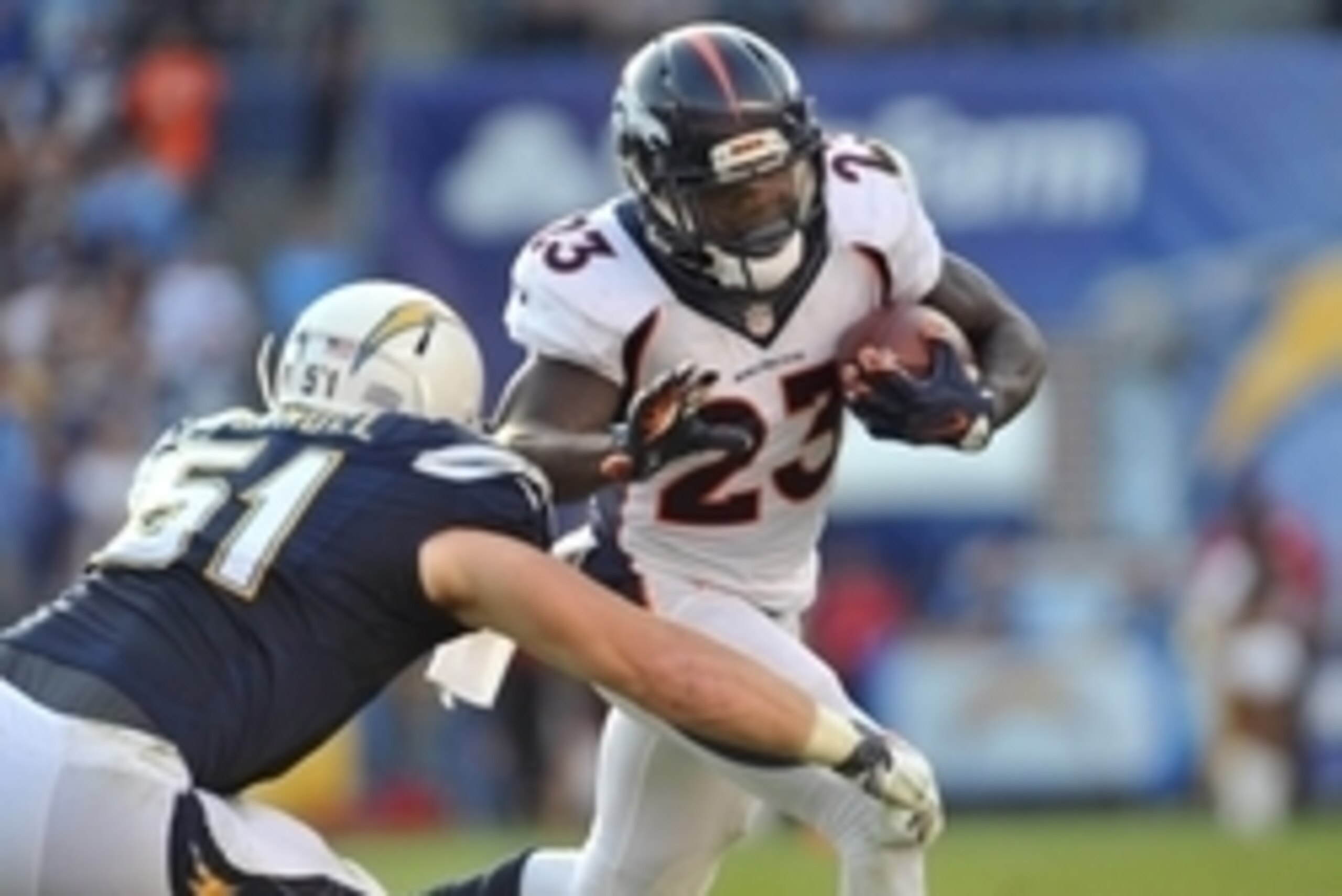 Dec 6, 2015; San Diego, CA, USA; Denver Broncos running back Ronnie Hillman (23) runs the ball while defended by San Diego Chargers linebacker Kyle Emanuel (51) during the second half of the game at Qualcomm Stadium. Denver won 17-3. Mandatory Credit: Orl
