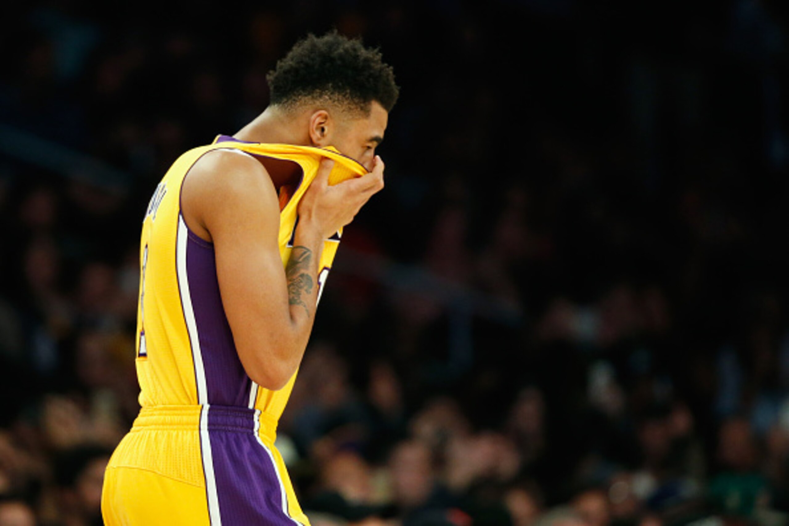 LOS ANGELES, CA - DECEMBER 15:  D'Angelo Russell #1 of the Los Angeles Lakers holds his hands to his face during the second half of  a game against the Milwaukee Bucks  at Staples Center on December 15, 2015 in Los Angeles, California.  NOTE TO USER: User