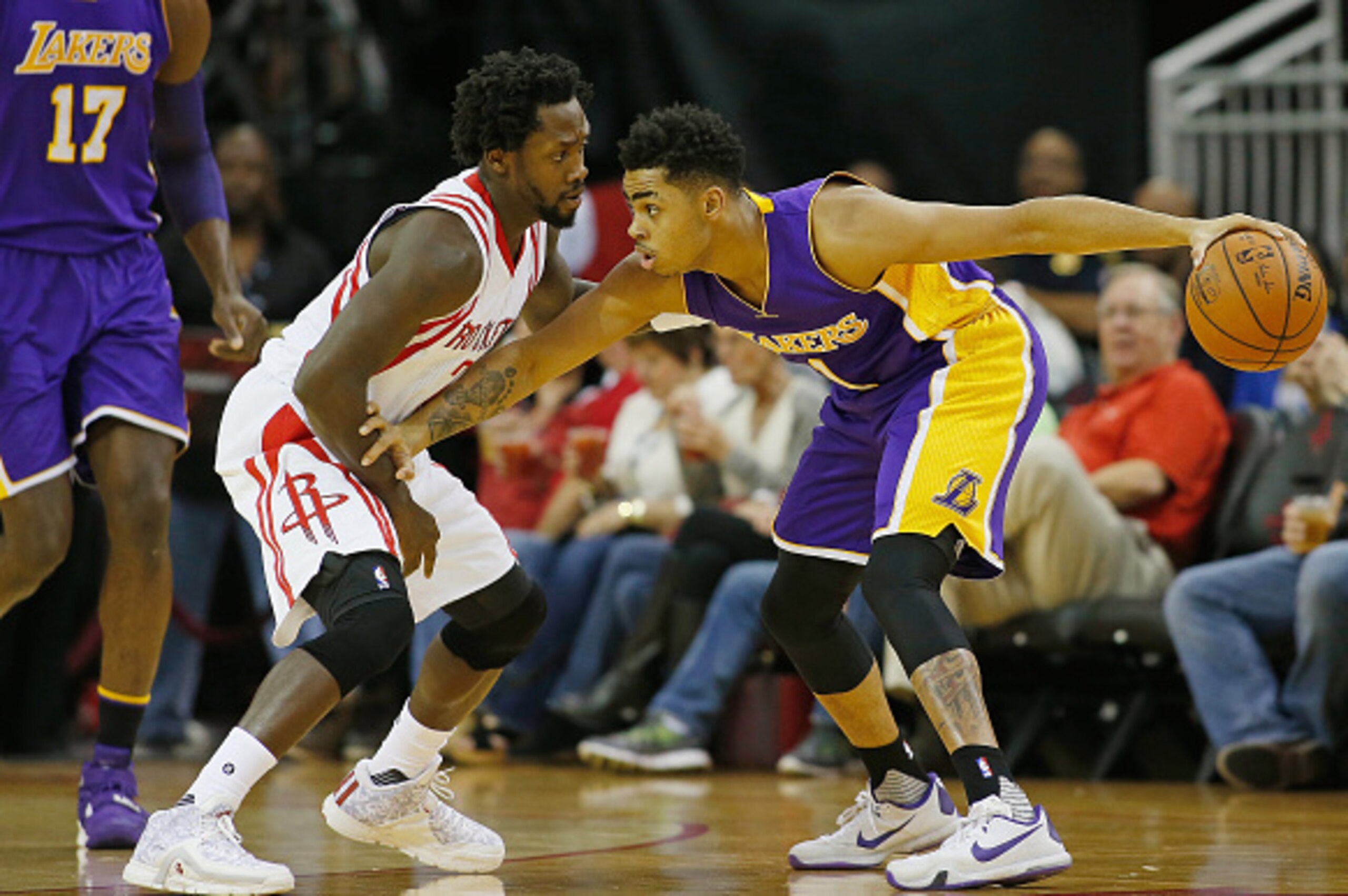 HOUSTON, TX - DECEMBER 12:  Patrick Beverley #2 of the Houston Rockets and D'Angelo Russell #1 of the Los Angeles Lakers battle for the ball during their game at Toyota Center on December 12, 2015 in Houston, Texas. NOTE TO USER: User expressly acknowledg