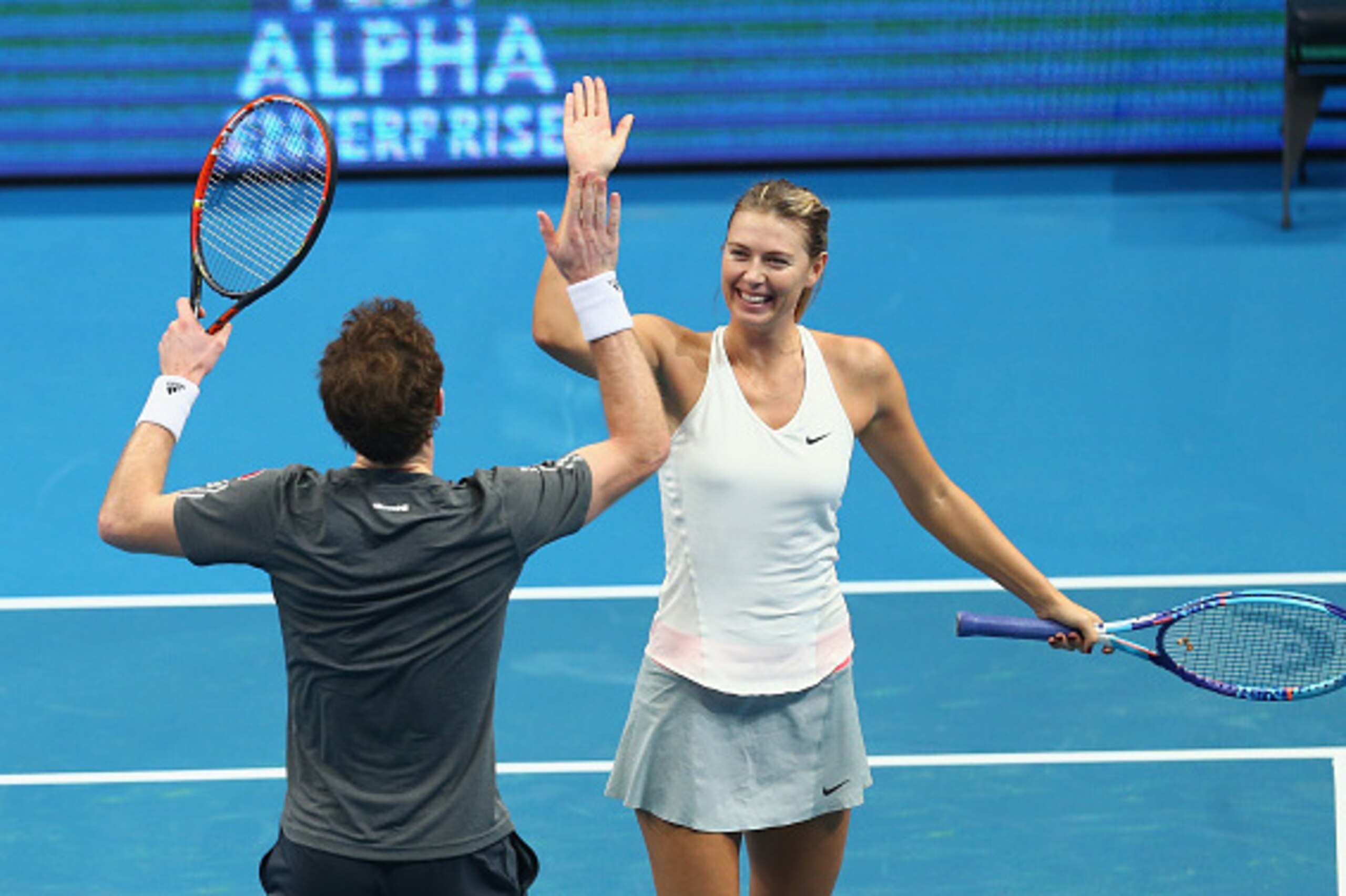 MANILA, PHILIPPINES - NOVEMBER 29:  Maria Sharapova and Andy Murray of the Manila Mavericks celebrate winning a game in their match against Rohan Bopanna and Sania Mirza of the Indian Aces during the Coca-Cola International Premier Tennis League at the Ma