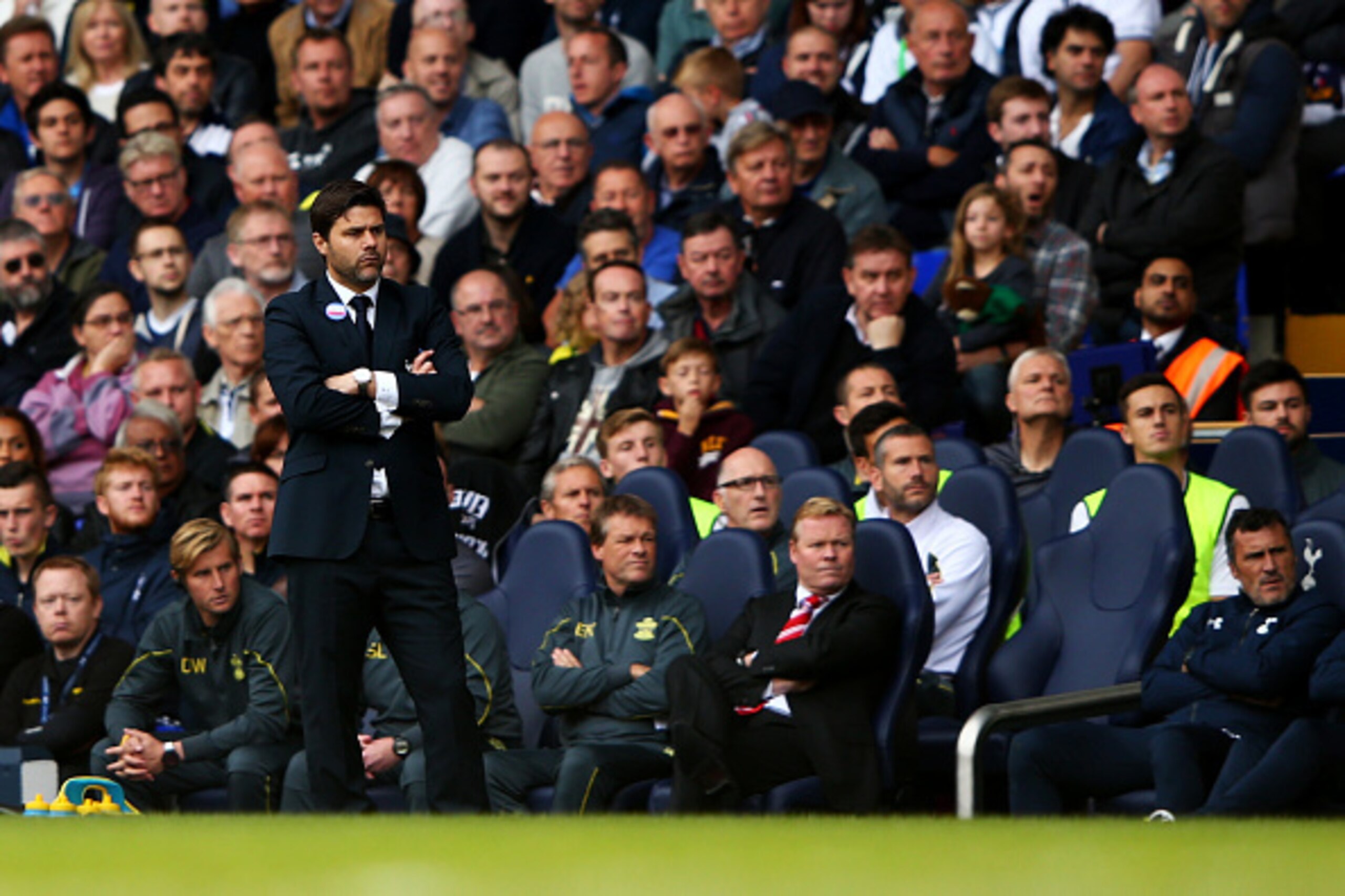 LONDON, ENGLAND - OCTOBER 05:  Manager Mauricio Pochettino of Spurs and Ronald Koeman, manager of Southampton watch the action during the Barclays Premier League match between Tottenham Hotspur and Southampton at White Hart Lane on October 5, 2014 in Lond