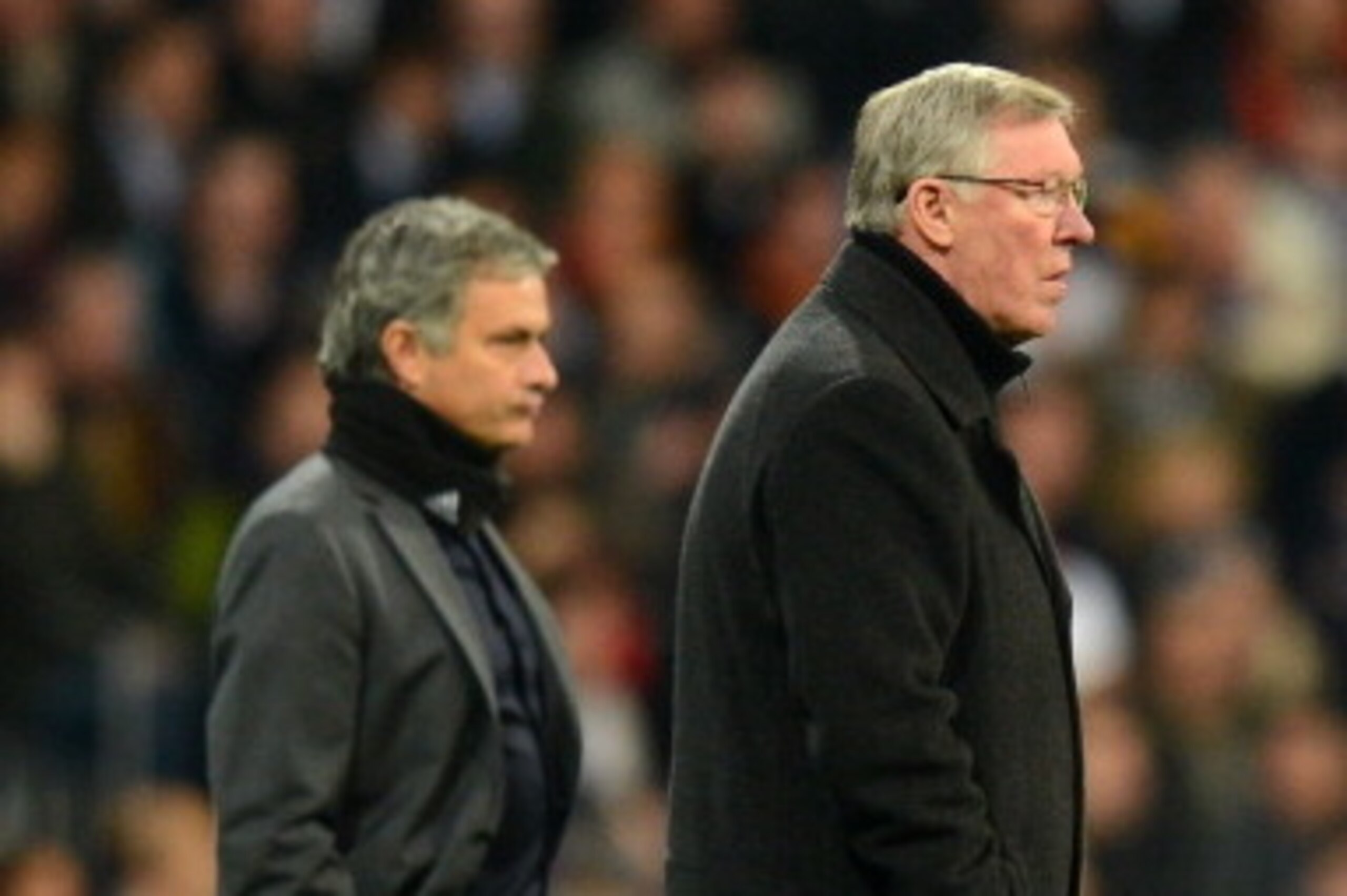MADRID, SPAIN - FEBRUARY 13:  Head Coach Jose Mourinho of Real Madrid and Manager Sir Alex Ferguson of Manchester United look on during the UEFA Champions League Round of 16 first leg match between Real Madrid and Manchester United at Estadio Santiago Ber
