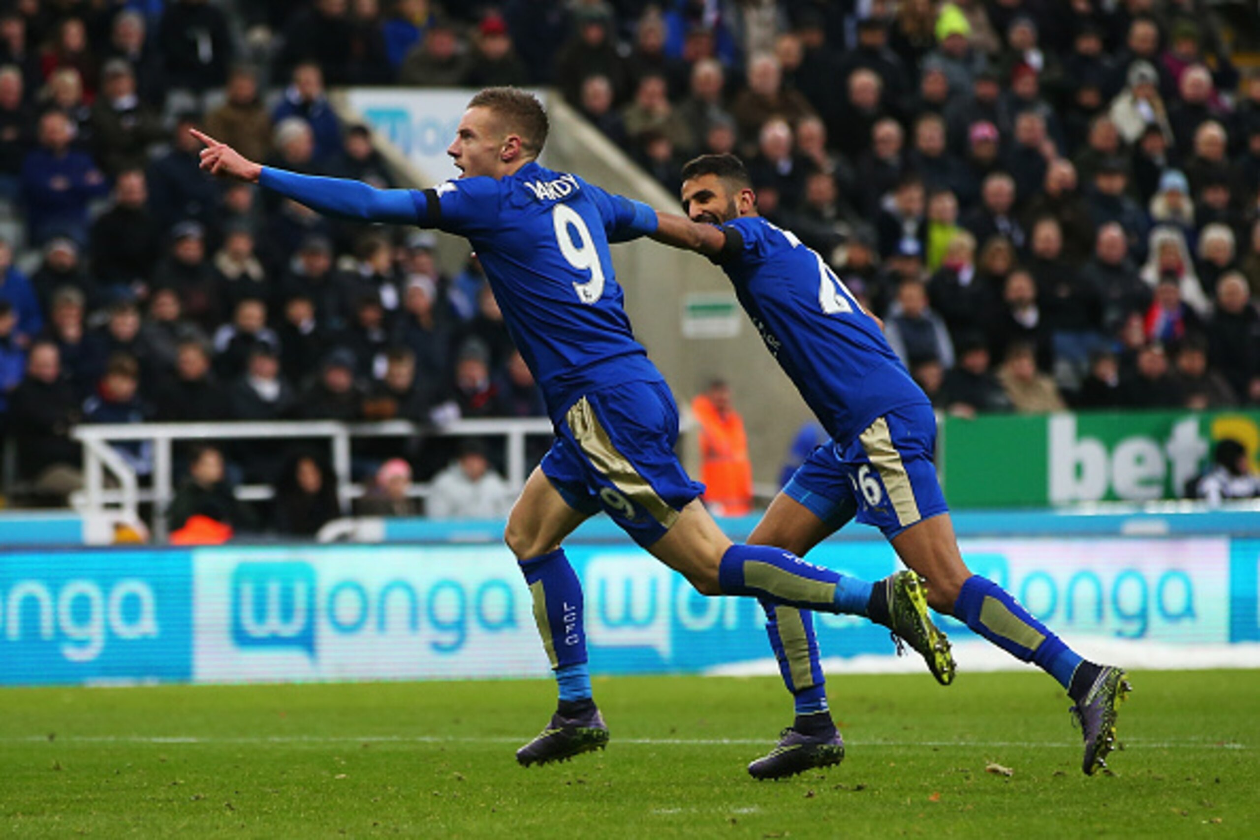 NEWCASTLE UPON TYNE, ENGLAND - NOVEMBER 21:  Jamie Vardy (L) of Leicester City celebrates scoring his team's first goal with his team mate Riyad Mahrez (R)  during the Barclays Premier League match between Newcastle United and Leicester City at St James' 