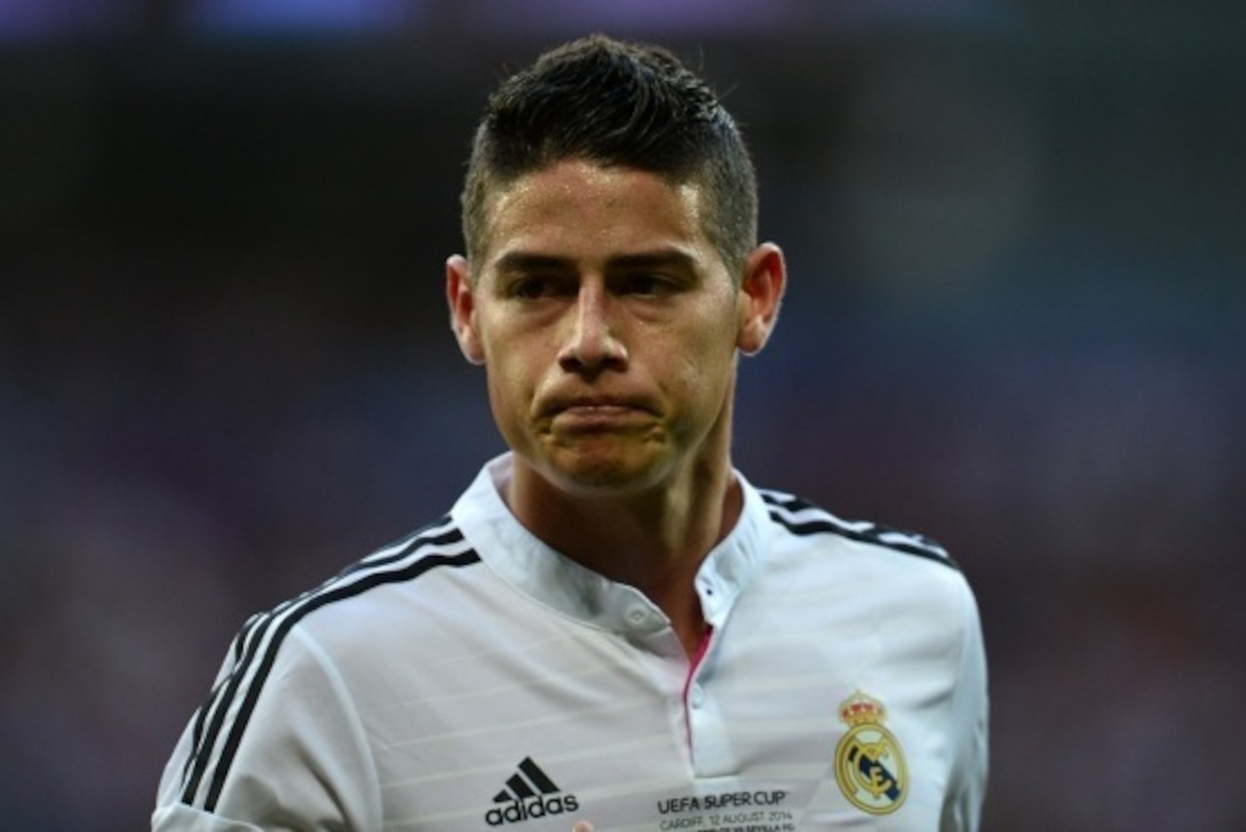 Real Madrids Colombian forward James Rodriguez looks on during the UEFA Super Cup football match between Real Madrid and Sevilla at Cardiff City Stadium in Cardiff, south Wales on August 12, 2014. Cristiano Ronaldo upstaged new team-mates Toni Kroos and J