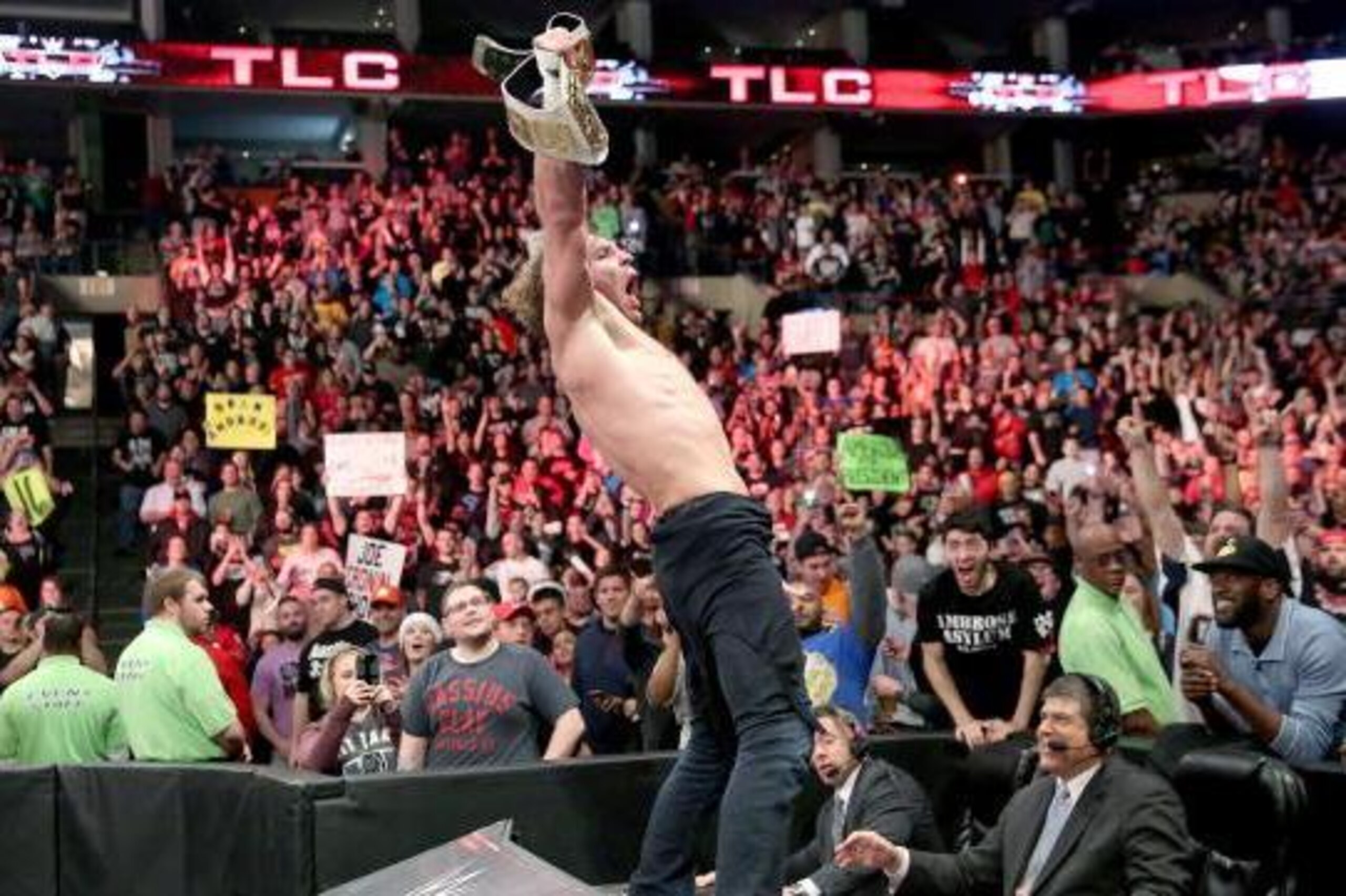 Dean Ambrose celebrates his title win at TLC. Dean Ambrose celebrates his title win at TLC.