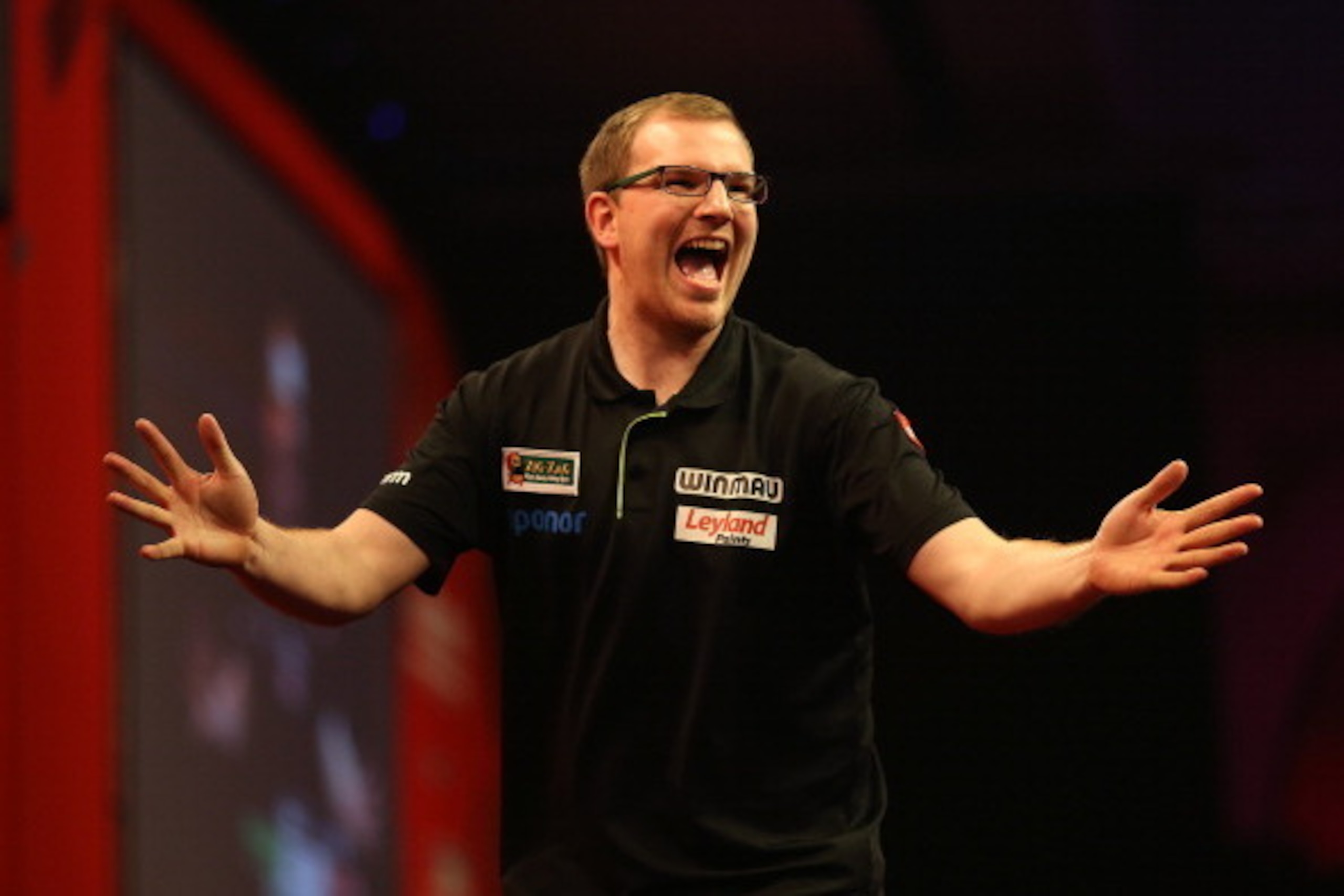 LONDON, ENGLAND - DECEMBER 22: Mark Webster of Wales celebrates after winning his second round match against John Henderson of Scotland during the Ladbrokes.com World Darts Championship on Day Ten at Alexandra Palace on December 22, 2013 in London, Englan