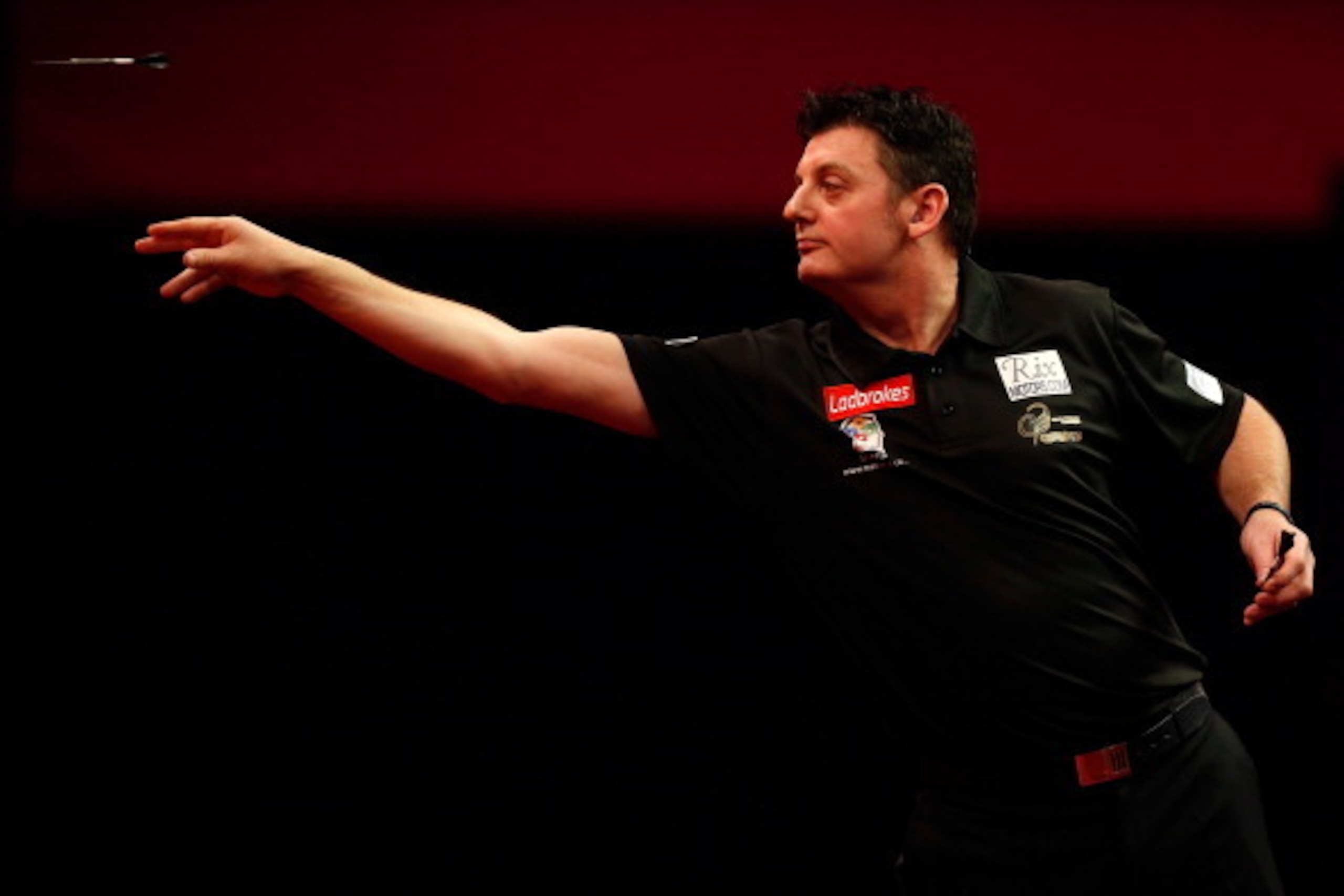 LONDON, ENGLAND - DECEMBER 27: Justin Pipe of England in action during his second round match against Devon Petersen of South Africa on day twelve of the Ladbrokes.com World Darts Championship at Alexandra Palace on December 27, 2013 in London, England.  