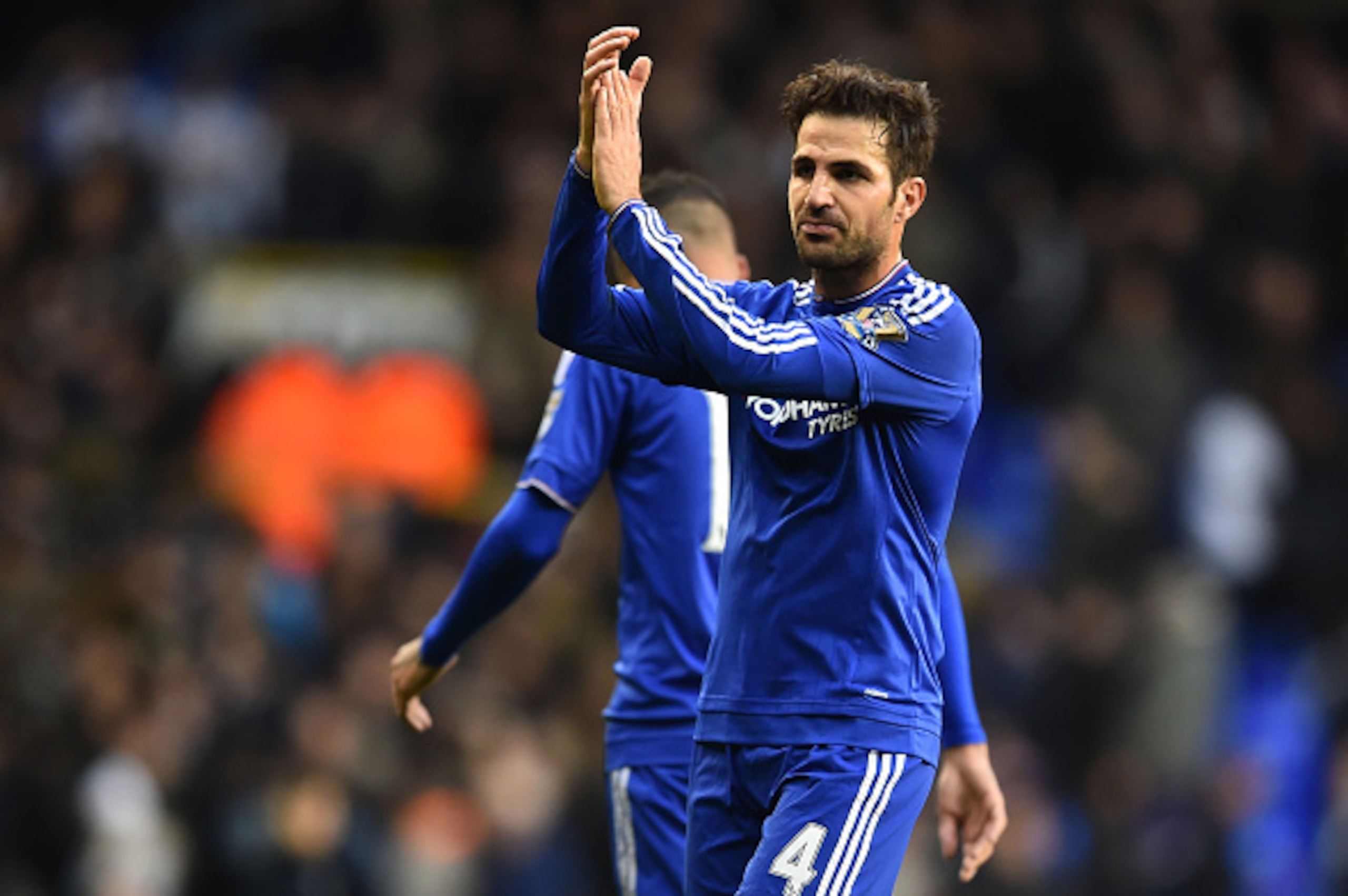 Chelsea's Spanish midfielder Cesc Fabregas applauds the fans after the English Premier League football match between Tottenham Hotspur and Chelsea at White Hart Lane in north London on November 29, 2015.      / AFP / BEN STANSALL        (Photo credit shou