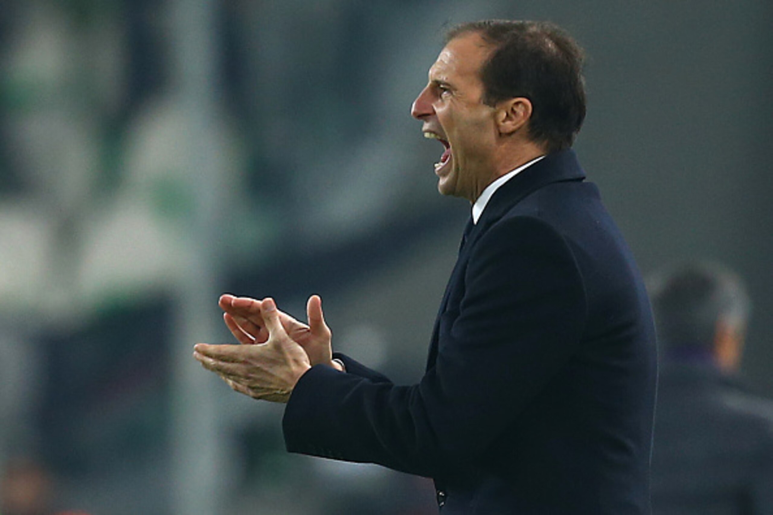 Juventus' coach Massimiliano Allegri reacts during the Italian Serie A  football match Juventus vs Fiorentina on December 13, 2015 at the 'Juventus Stadium' in Turin.  AFP PHOTO / MARCO BERTORELLO / AFP / MARCO BERTORELLO        (Photo credit should read 