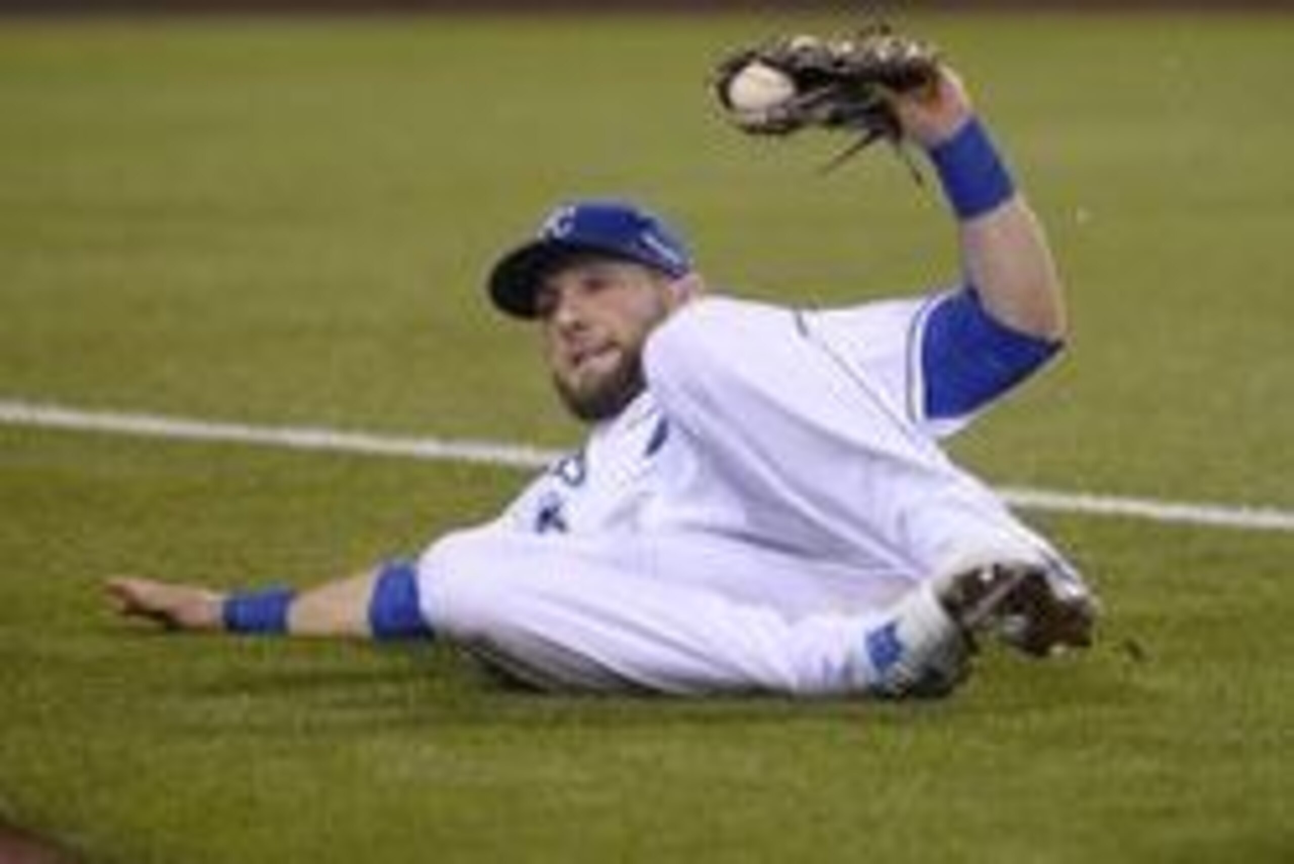 Oct 14, 2015; Kansas City, MO, USA; Kansas City Royals left fielder Alex Gordon makes a sliding catch against the Houston Astros in the sixth inning in game five of the ALDS at Kauffman Stadium. Mandatory Credit: John Rieger-USA TODAY Sports