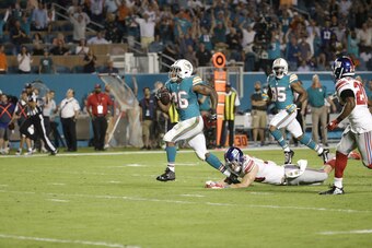 After scoring two touchdowns during the opening half of Monday night's loss to the New York Giants, Lamar Miller barely touched the ball in the second half.