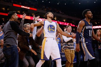 OAKLAND, CA - NOVEMBER 02:  Stephen Curry #30 of the Golden State Warriors reacts with the crowd after he made a three-point basket over Mike Conley #11 of the Memphis Grizzlies at ORACLE Arena on November 2, 2015 in Oakland, California. NOTE TO USER: Use