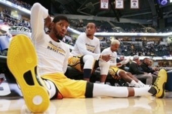 Dec 16, 2015; Indianapolis, IN, USA; Indiana Pacers forward Paul George (13) stretches before the game against the Dallas Mavericks at Bankers Life Fieldhouse. Mandatory Credit: Brian Spurlock-USA TODAY Sports
