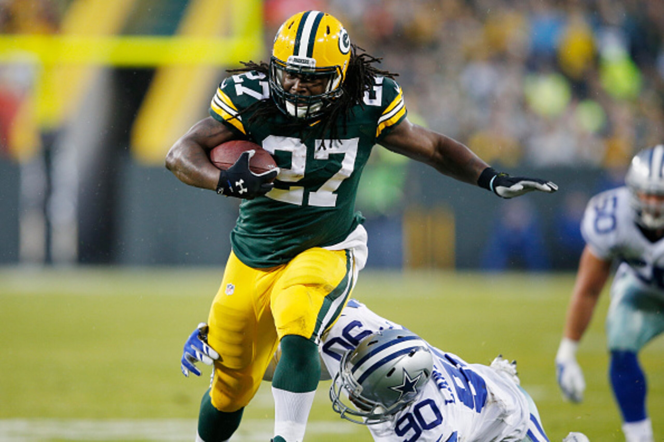 GREEN BAY, WI - DECEMBER 13: Eddie Lacy #27 of the Green Bay Packers runs the ball against the Dallas Cowboys during the game at Lambeau Field on December 13, 2015 in Green Bay, Wisconsin. The Packers defeated the Cowboys 28-7. (Photo by Joe Robbins/Getty