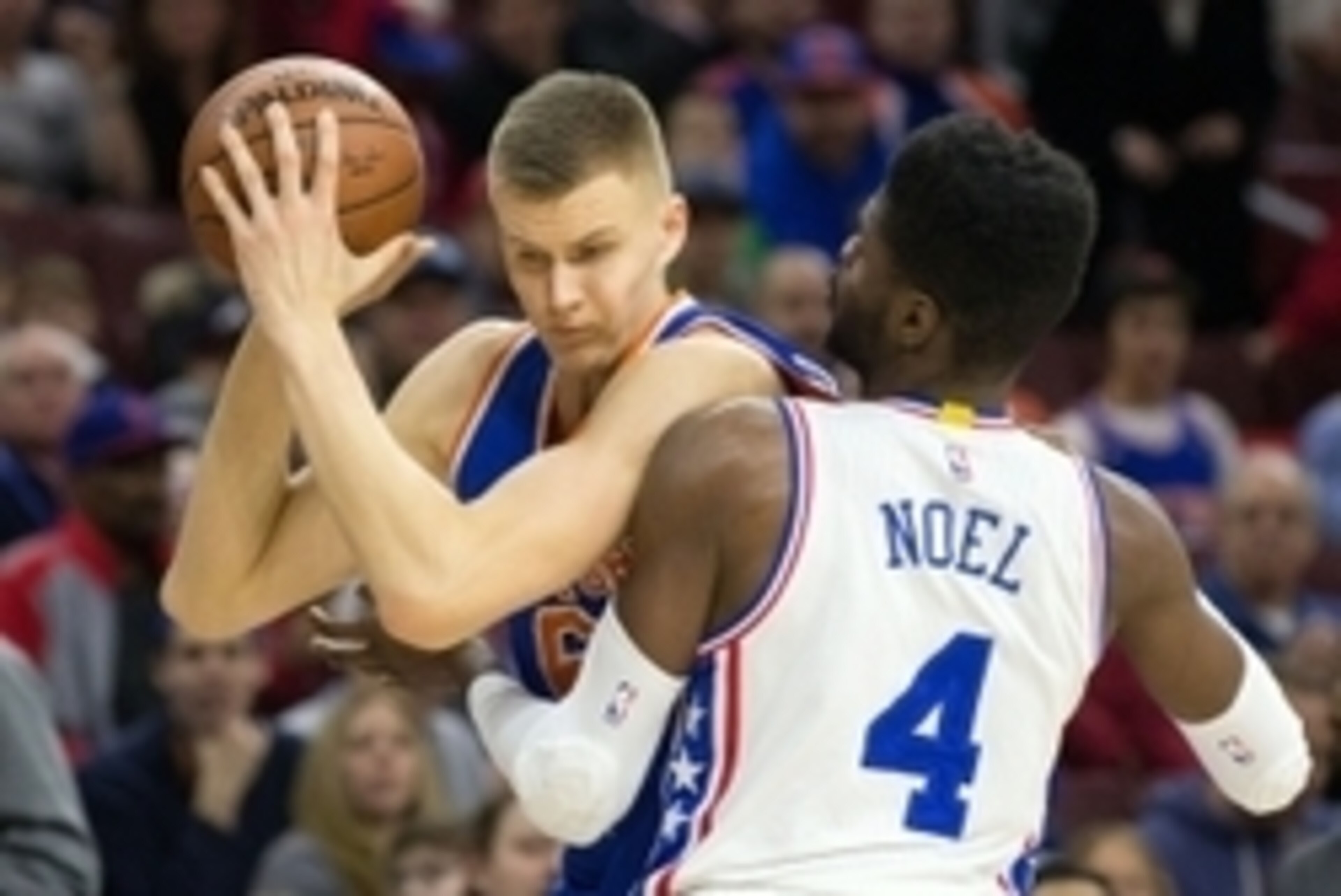 Dec 18, 2015; Philadelphia, PA, USA; New York Knicks forward Kristaps Porzingis (6) battles for position against Philadelphia 76ers forward Nerlens Noel (4) during the first quarter at Wells Fargo Center. Mandatory Credit: Bill Streicher-USA TODAY Sports