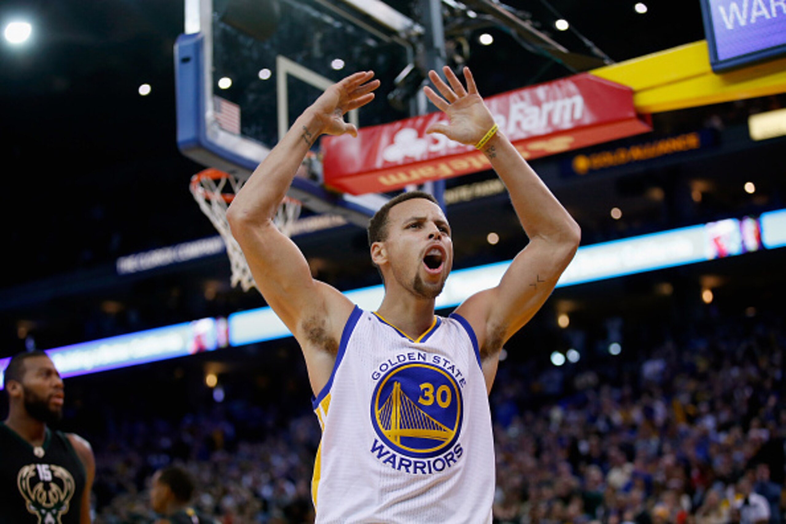 OAKLAND, CA - DECEMBER 18:  Stephen Curry #30 of the Golden State Warriors reacts towards the crowd during their game against the Milwaukee Bucks at ORACLE Arena on December 18, 2015 in Oakland, California. NOTE TO USER: User expressly acknowledges and ag