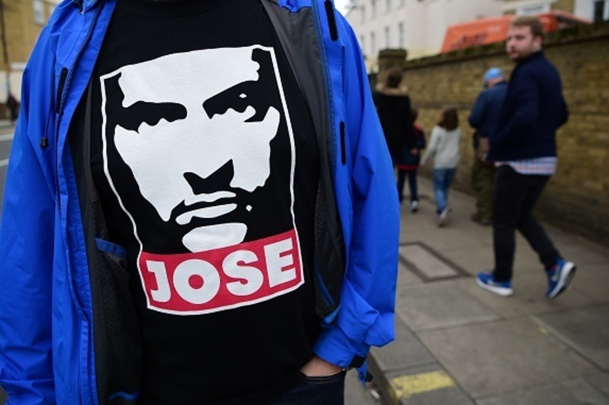 A supporter wears a t-shirt featuring Chelsea's former Portuguese manager Jose Mourinho before the English Premier League football match between Chelsea and Sunderland at Stamford Bridge in London on December 19, 2015. Jose Mourinho attended the Champions