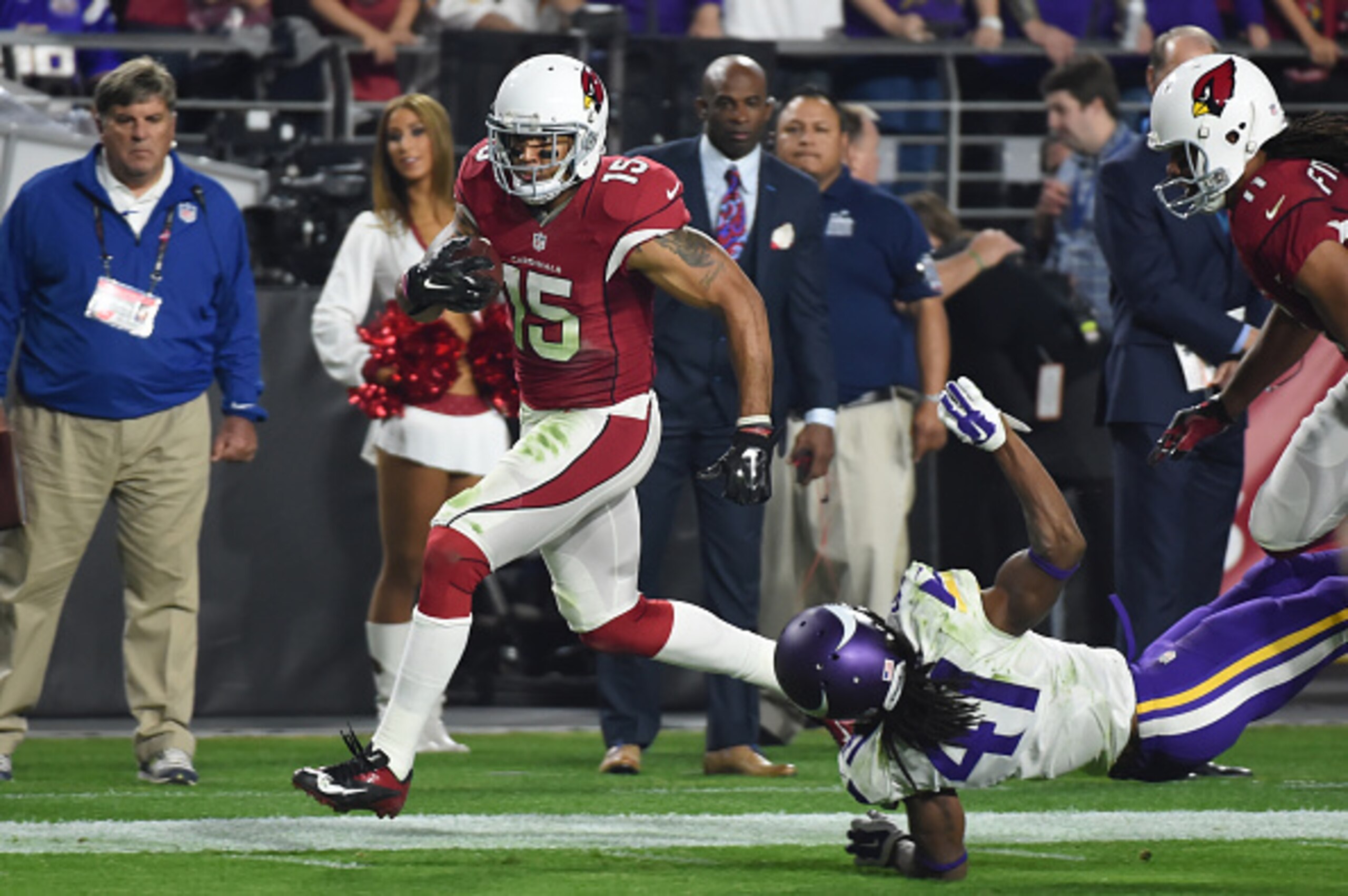 GLENDALE, AZ - DECEMBER 10: Wide receiver Michael Floyd #15 of the Arizona Cardinals runs in a 42 yard touchdown reception in front of safety Anthony Harris #41 of the Minnesota Vikings during the third quarter of the NFL game at University of Phoenix Sta