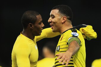 WATFORD, ENGLAND - DECEMBER 05:  Odion Ighalo (L) of Watford celebrates scoring his team's second goal with his team mate Troy Deeney (R) during the Barclays Premier League match between Watford and Norwich City at Vicarage Road on December 5, 2015 in Wat