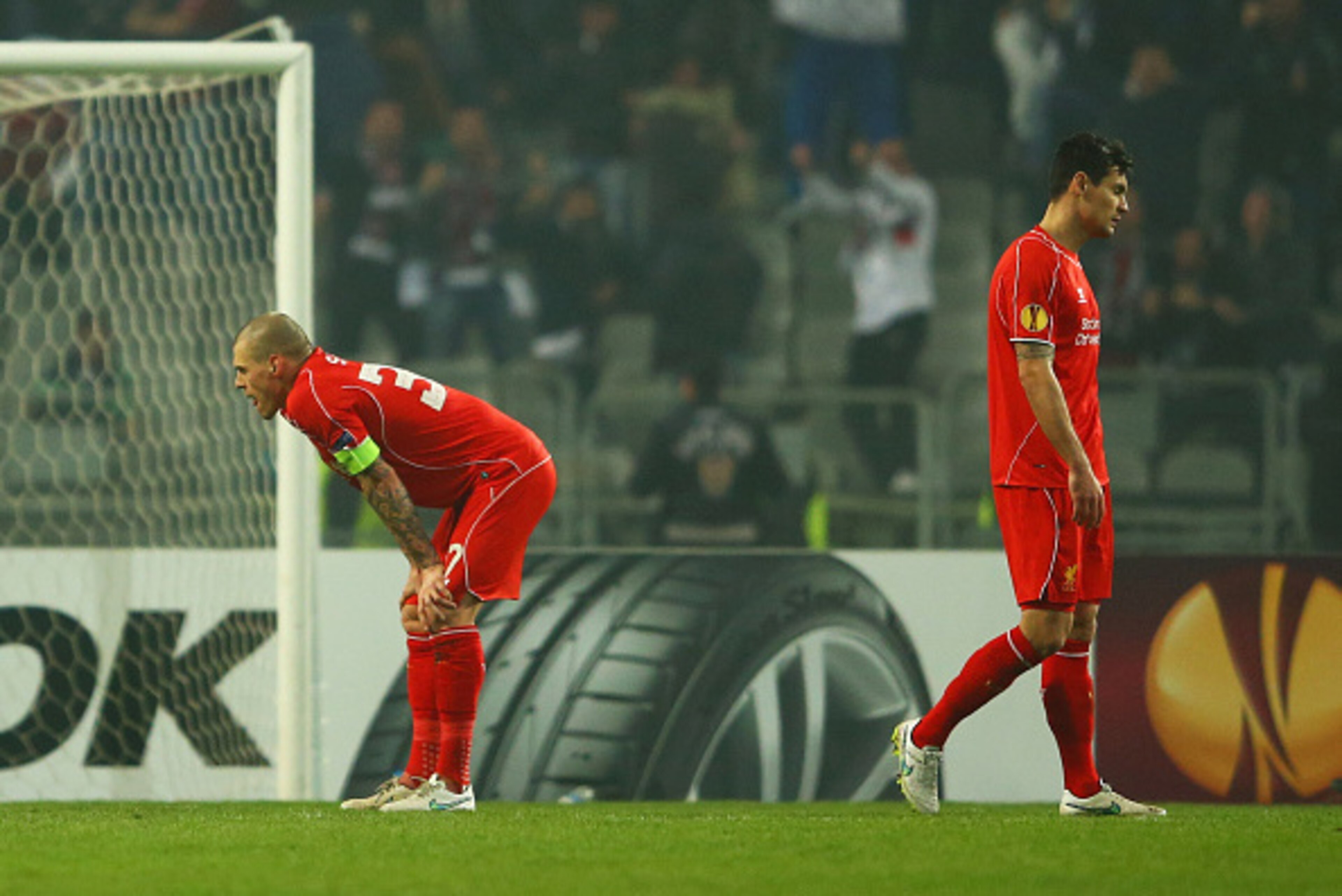 ISTANBUL, TURKEY - FEBRUARY 26: Martin Skrtel (L) and Dejan Lovren of Liverpool look dejected as Omer Arslan of Besiktas scores their first goal during the UEFA Europa League Round of 32 second leg match between Besiktas JK and Liverpool FC on February 2 ISTANBUL, TURKEY - FEBRUARY 26: Martin Skrtel (L) and Dejan Lovren of Liverpool look dejected as Omer Arslan of Besiktas scores their first goal during the UEFA Europa League Round of 32 second leg match between Besiktas JK and Liverpool FC on February 2