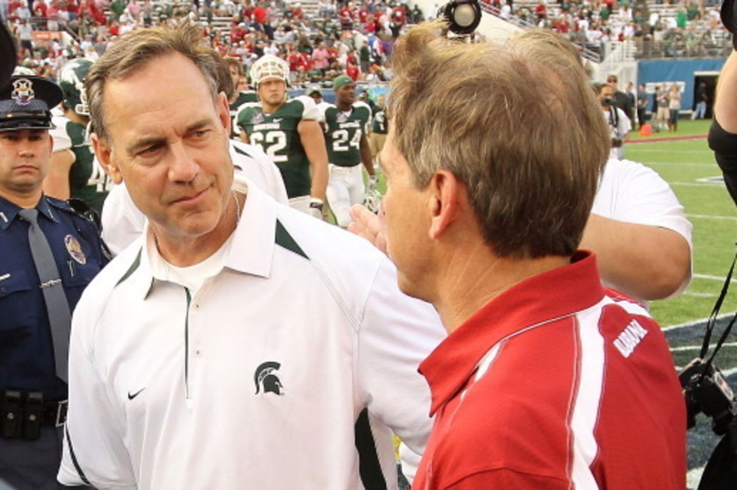 ORLANDO, FL - JANUARY 01:  Alabama Crimson Tide Head Coach Nick Saban greets Michigan State Spartans Head Coach Mark Dantonio after winning the Capitol One Bowl against at the Florida Citrus Bowl on January 1, 2011 in Orlando, Florida.  (Photo by Mike Ehr