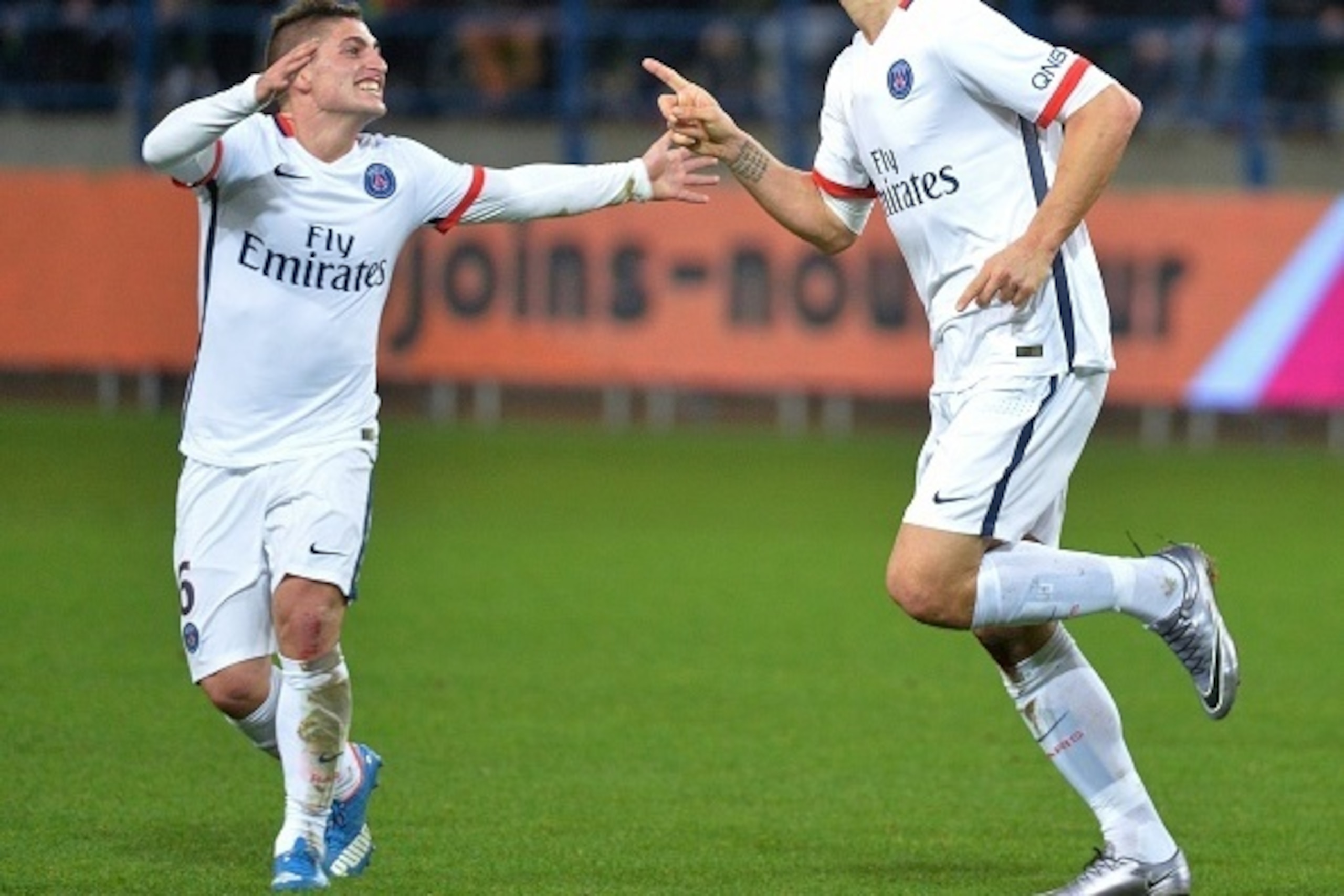Paris Saint-Germain's Swedish forward Zlatan Ibrahimovic (R) celebrates with Paris Saint-Germain's Italian midfielder Marco Verratti (L) after scoring a goal during the French L1 football match between Caen (SMC) and Paris Saint-Germain (PSG) on December 