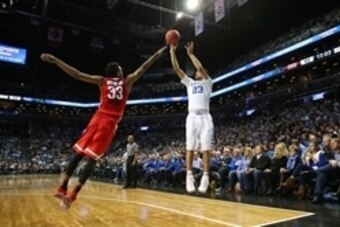 Dec 19, 2015; Brooklyn, NY, USA; Kentucky Wildcats guard Jamal Murray (23) shoots over Ohio State Buckeyes forward Keita Bates-Diop (33) during the second half at Barclays Center. Ohio State Buckeyes won 74-67. Mandatory Credit: Anthony Gruppuso-USA TODAY