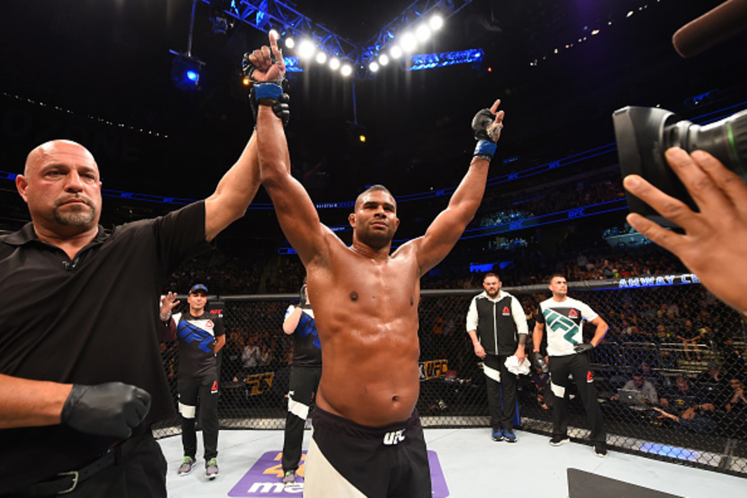ORLANDO, FL - DECEMBER 19:   Alistair Overeem celebrates his TKO victory over Junior dos Santos in their heavyweight bout during the UFC Fight Night event at the Amway Center on December 19, 2015 in Orlando, Florida. (Photo by Josh Hedges/Zuffa LLC/Zuffa 