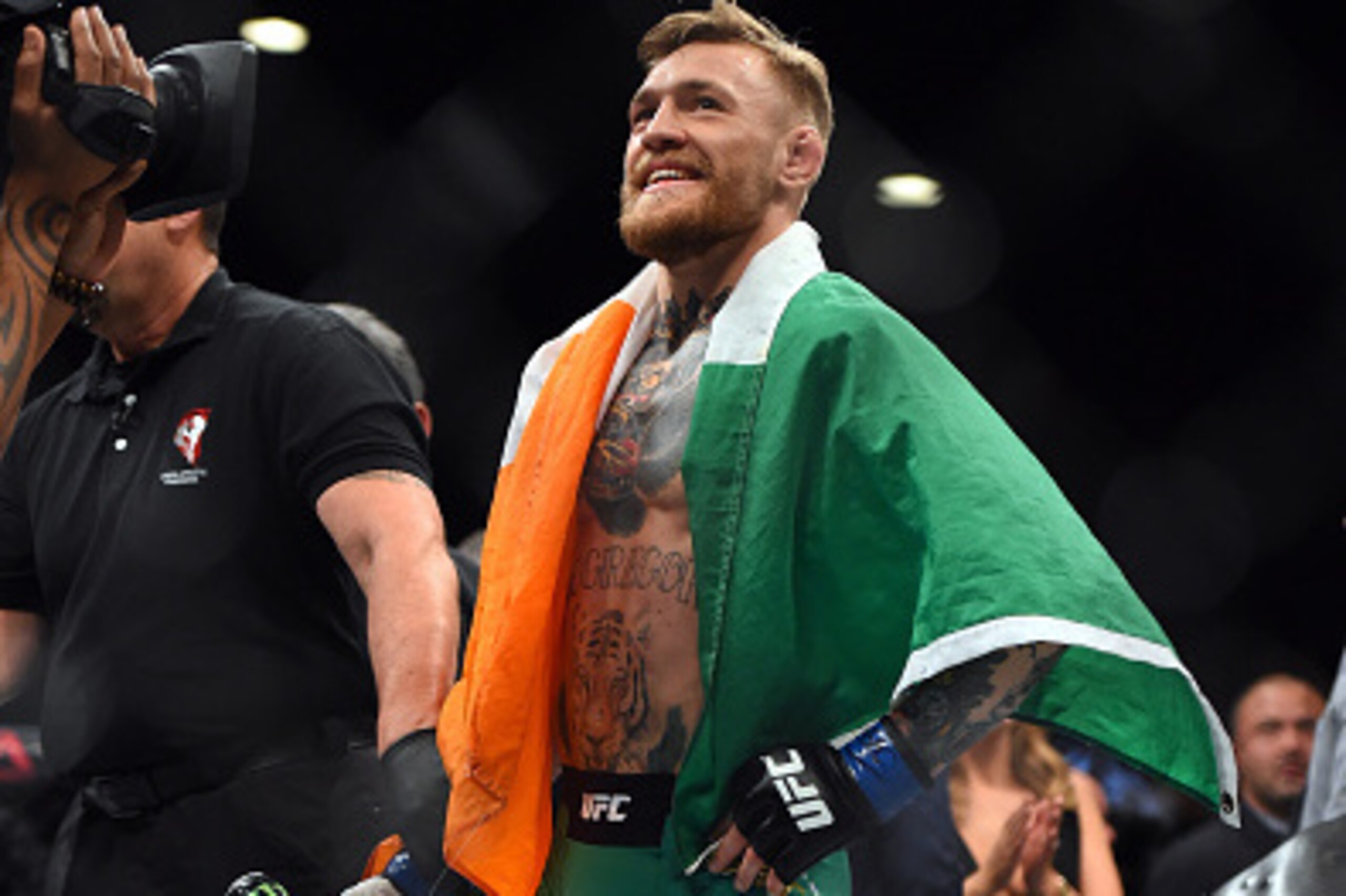 LAS VEGAS, NEVADA - DECEMBER 12:  Conor McGregor of Ireland celebrates after defeating Jose Aldo of Brazil in their featherweight championship bout during the UFC 194 event inside MGM Grand Garden Arena on December 12, 2015 in Las Vegas, Nevada.  (Photo b