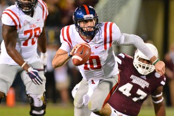 Nov 28, 2015; Starkville, MS, USA; Mississippi Rebels quarterback Chad Kelly (10) runs the ball during the second quarter of the game against the Mississippi State Bulldogs at Davis Wade Stadium. Mandatory Credit: Matt Bush-USA TODAY Sports