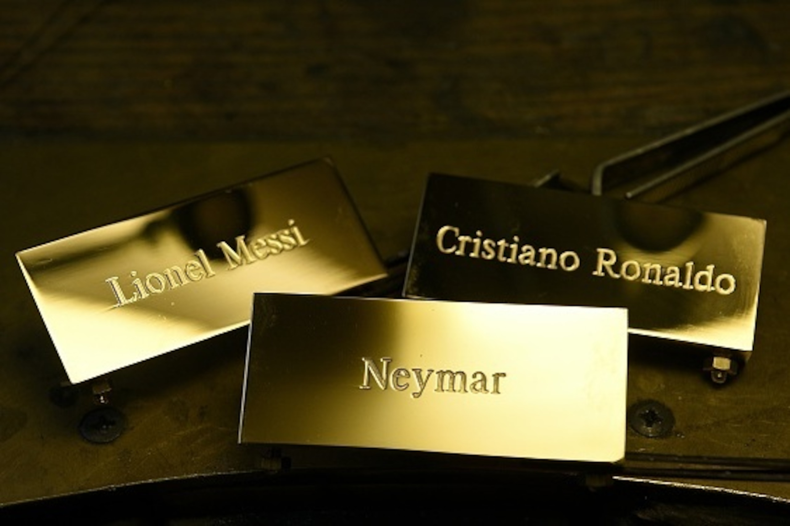 A picture taken on December 15, 2015 shows three plaques reading, 'Cristiano Ronaldo', 'Lionel Messi' and 'Neymar' at the Mellerio jewellers in Paris.
Barcelona's Argentinian forward Lionel Messi, Barcelona's Brazilian forward Neymar and Real Madrid's Por