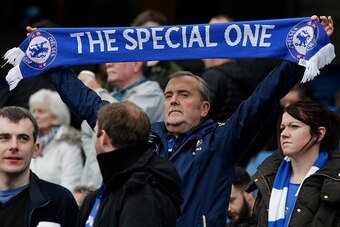 A Chelsea fan holds up a scarf in support of Chelsea's former Portuguese manager Jose Mourinho before the English Premier League football match between Chelsea and Sunderland at Stamford Bridge in London on December 19, 2015. 
AFP PHOTO / IAN KINGTON
REST