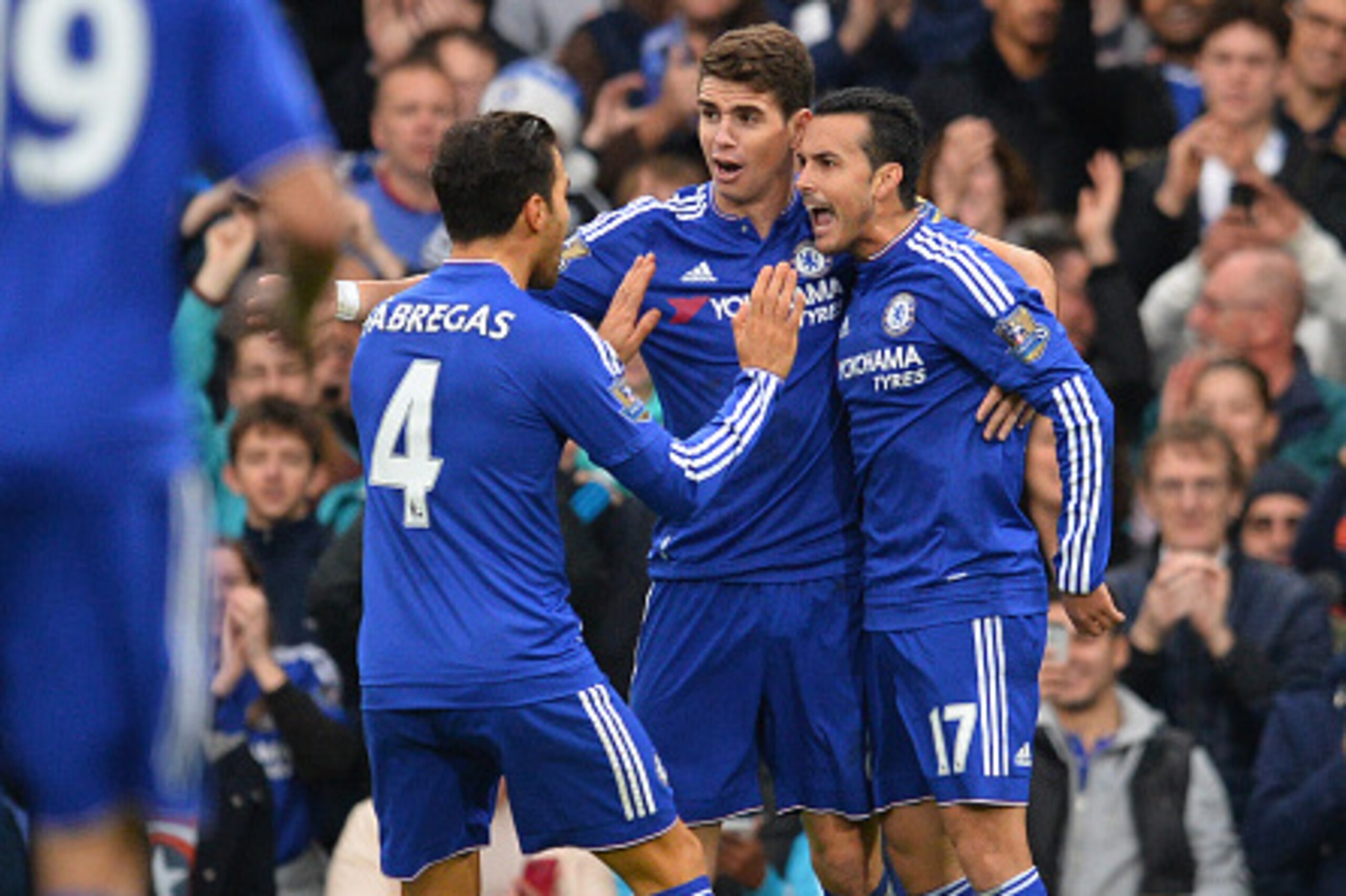 Chelsea's Spanish midfielder Pedro (R) celebrates with Chelsea's Brazilian midfielder Oscar (C) and Chelsea's Spanish midfielder Cesc Fabregas after scoring during the English Premier League football match between Chelsea and Sunderland at Stamford Bridge Chelsea's Spanish midfielder Pedro (R) celebrates with Chelsea's Brazilian midfielder Oscar (C) and Chelsea's Spanish midfielder Cesc Fabregas after scoring during the English Premier League football match between Chelsea and Sunderland at Stamford Bridge