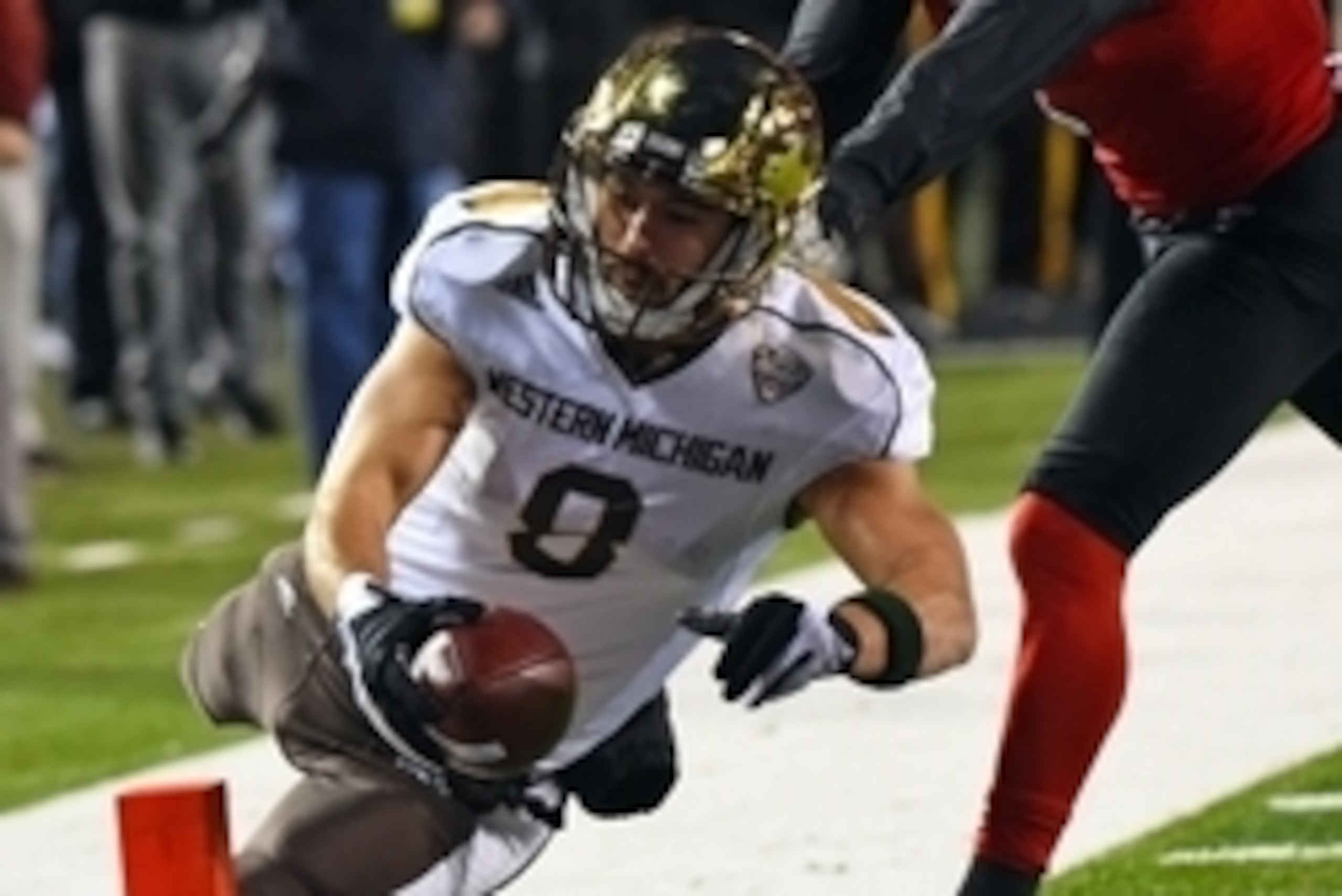 Nov 18, 2015; DeKalb, IL, USA; Western Michigan Broncos wide receiver Daniel Braverman (8) dives for the end zone against Northern Illinois Huskies safety Marlon Moore (2) during the second quarter at Huskie Stadium. Mandatory Credit: Mike DiNovo-USA TODA