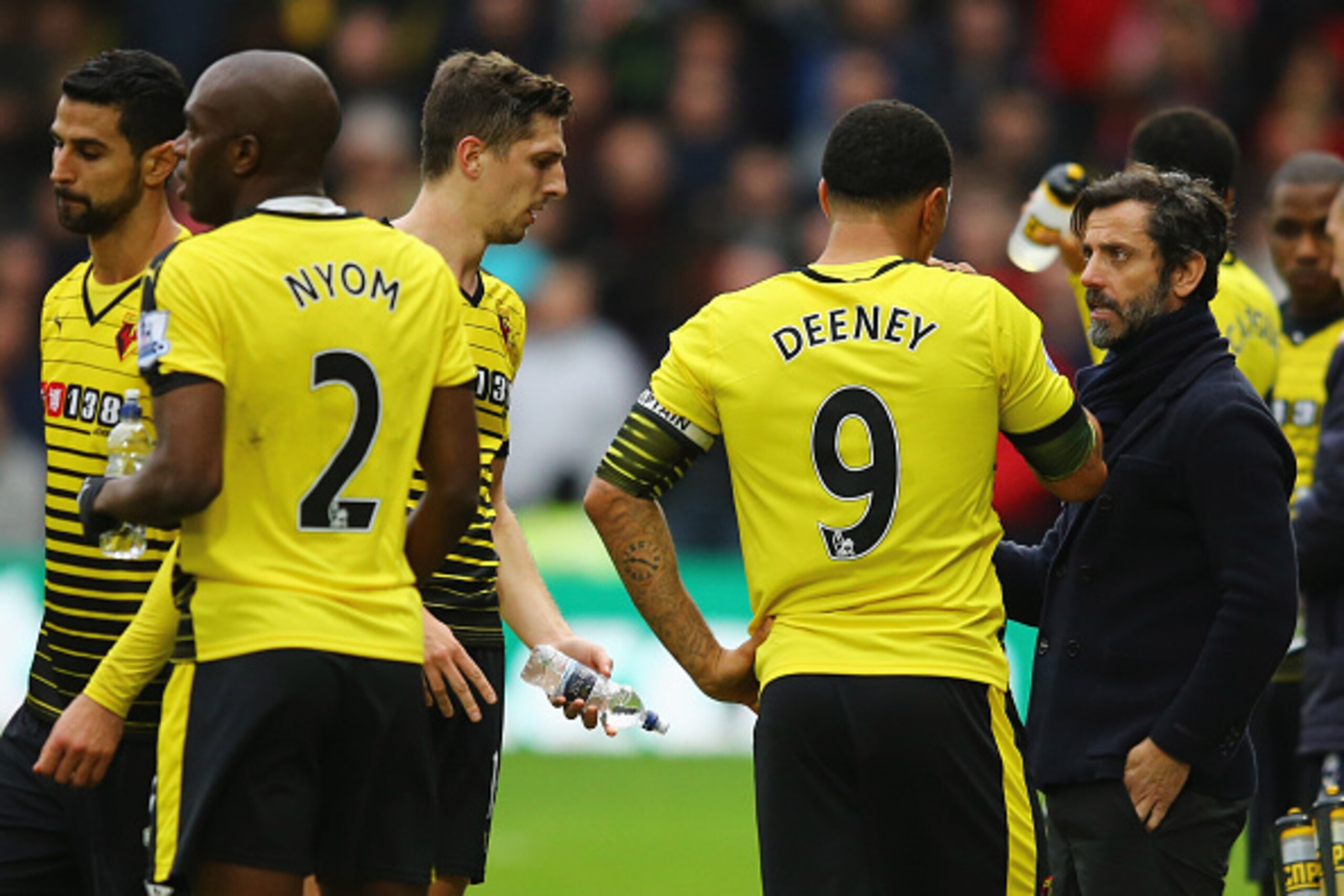 WATFORD, ENGLAND - DECEMBER 20:  Quique Flores manager of Watford talks to Troy Deeney of Watford (9) during the Barclays Premier League match between Watford and Liverpool at Vicarage Road on December 20, 2015 in Watford, England.  (Photo by Richard Heat
