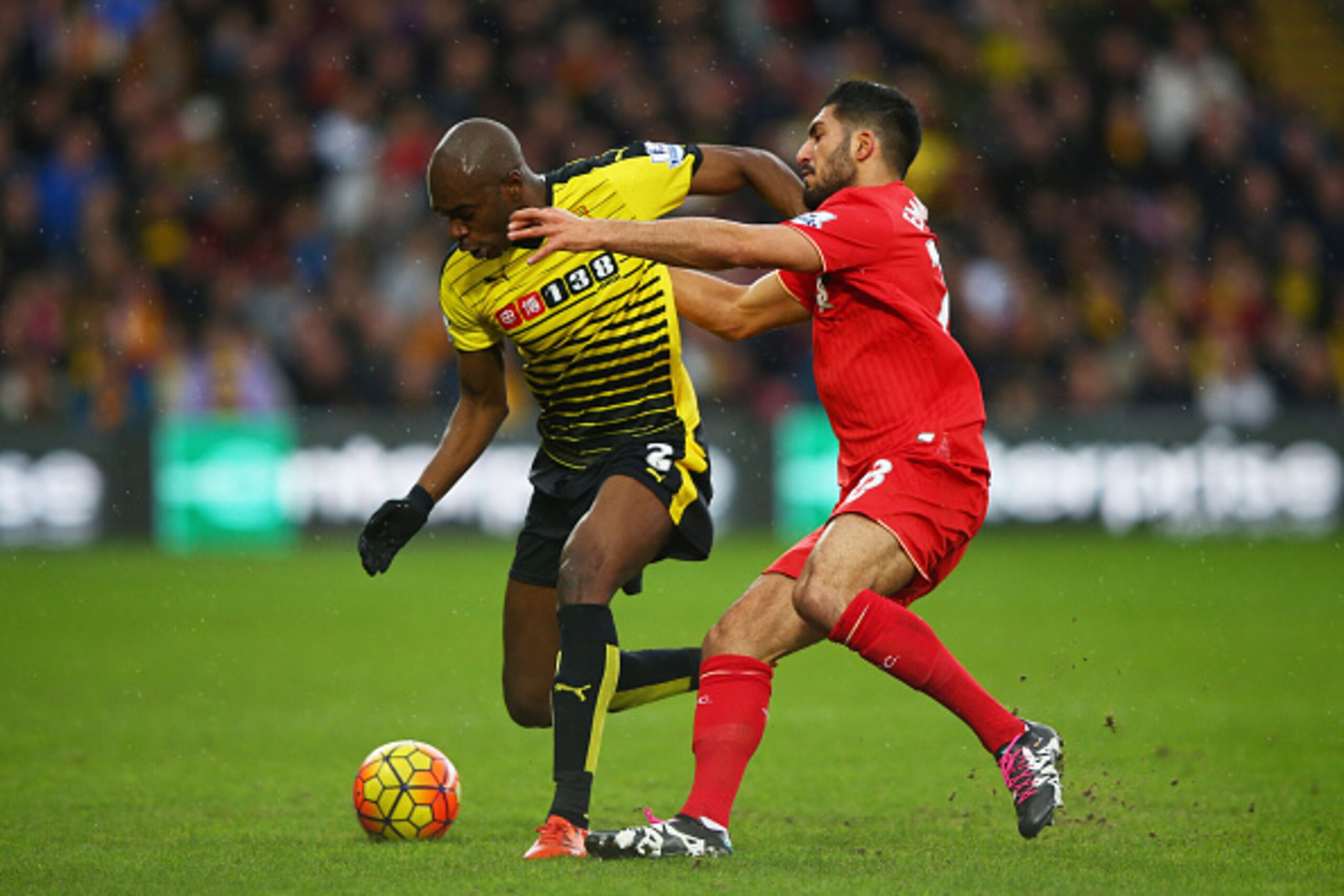 WATFORD, ENGLAND - DECEMBER 20:  Allan-Romeo Nyom of Watford holds off Emre Can of Liverpool during the Barclays Premier League match between Watford and Liverpool at Vicarage Road on December 20, 2015 in Watford, England.  (Photo by Ian Walton/Getty Imag