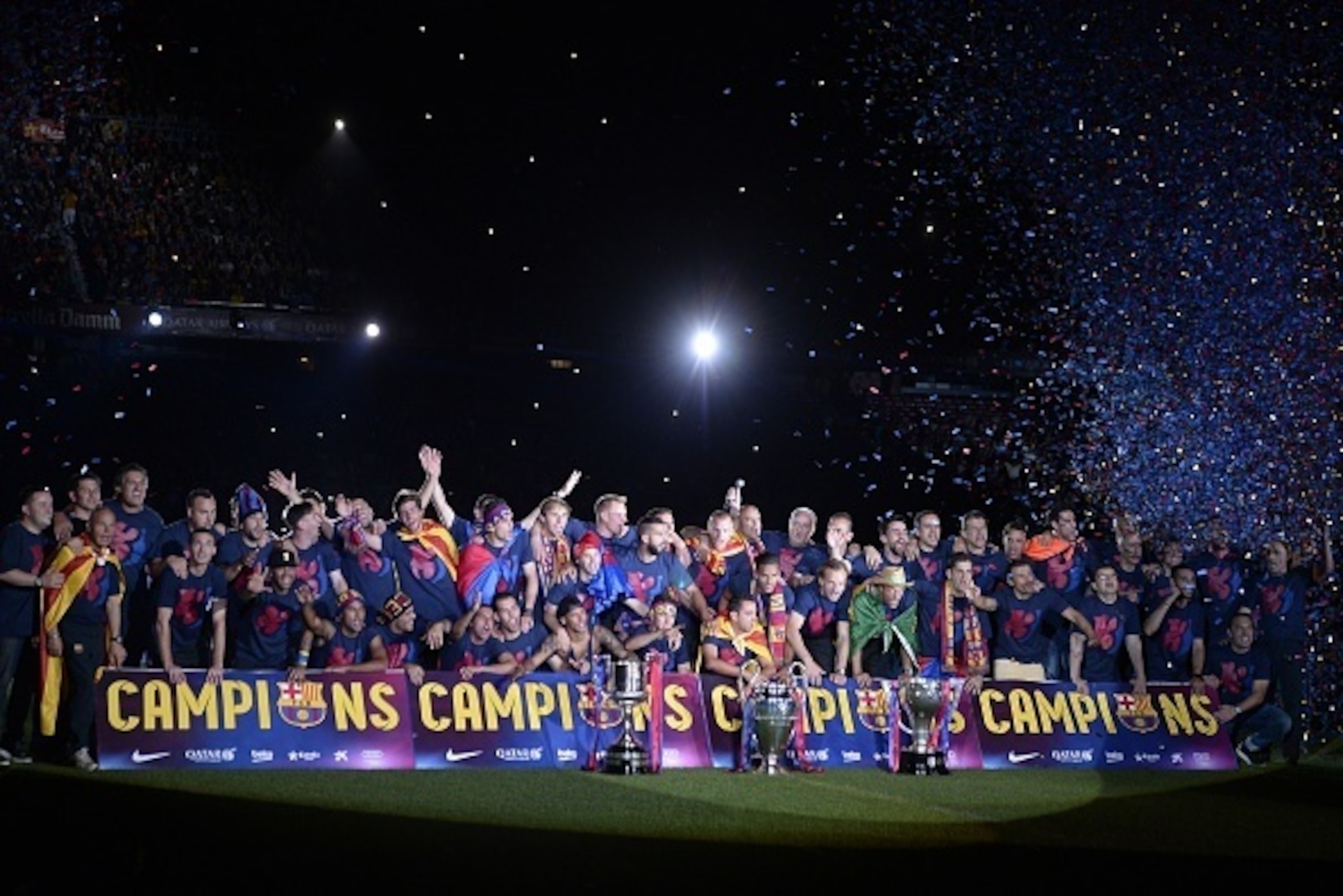 Barcelona players pose as they take part in the celebrations held for their victory over Juventus, one day after the UEFA Champions League final football, at the Camp Nou stadium in Barcelona on June 7, 2015. Luis Suarez and Neymar scored second-half goal