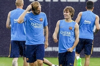Barcelona's Croatian midfielder Ivan Rakitic (L) and Barcelona's Croatian midfielder Alen Halilovic (R) take part in a training session at the Sports Center FC Barcelona Joan Gamper in Sant Joan Despi, near Barcelona on August 13, 2015.  AFP PHOTO / QUIQU