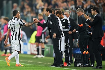 TURIN, ENGLAND - MAY 05:  Carlos Tevez of Juventus shakes hands with Massimiliano Allegri manager of Juventus as he is substituted during the UEFA Champions League semi final first leg match between Juventus and Real Madrid CF at Juventus Arena on May 5, 