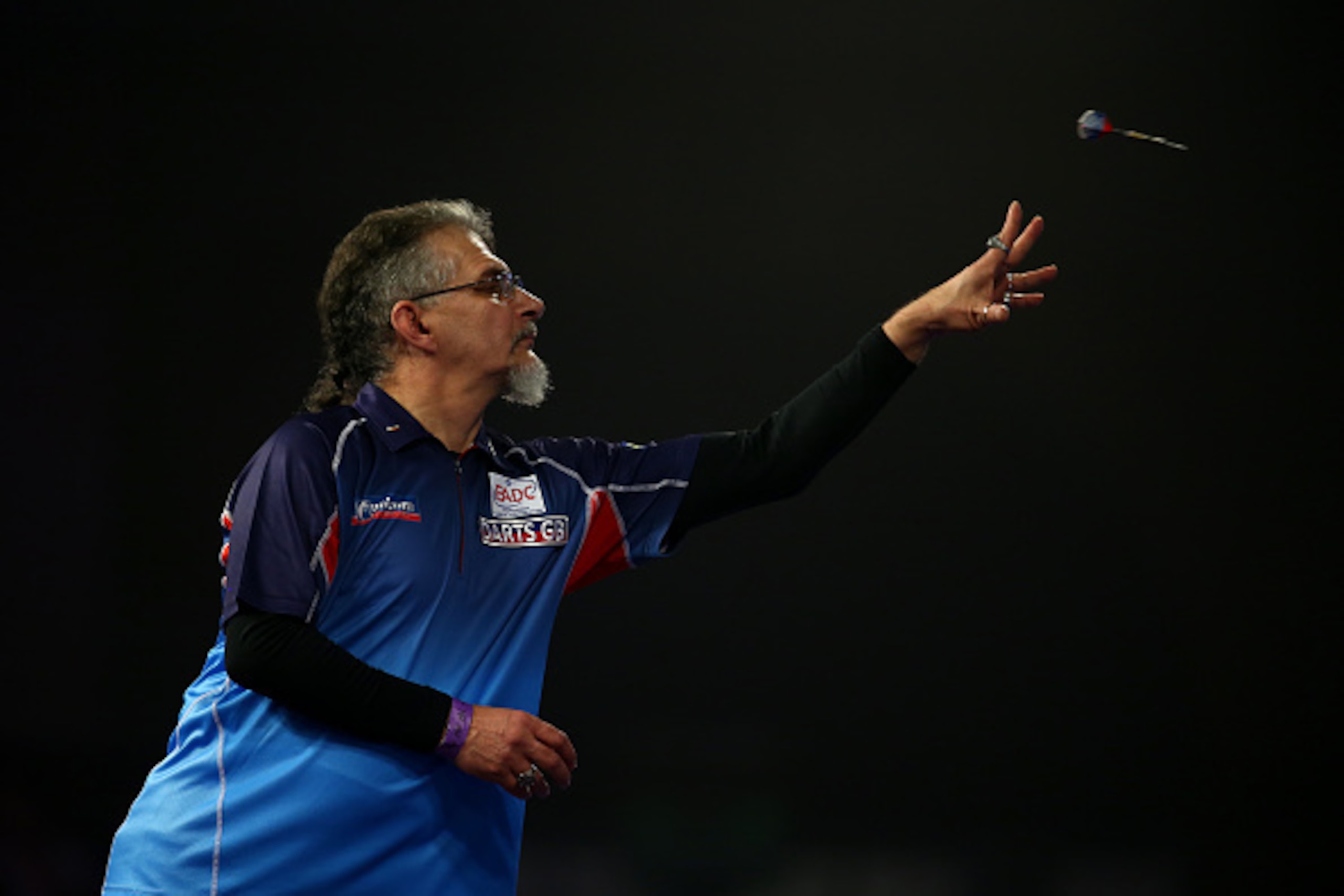 LONDON, ENGLAND - DECEMBER 20: Aleksandr Oreshkin of Russia in action during his preliminary round match against Paul Lim of Singapore during the 2016 William Hill PDC World Darts Championships on Day Four at Alexandra Palace on December 20, 2015 in Londo