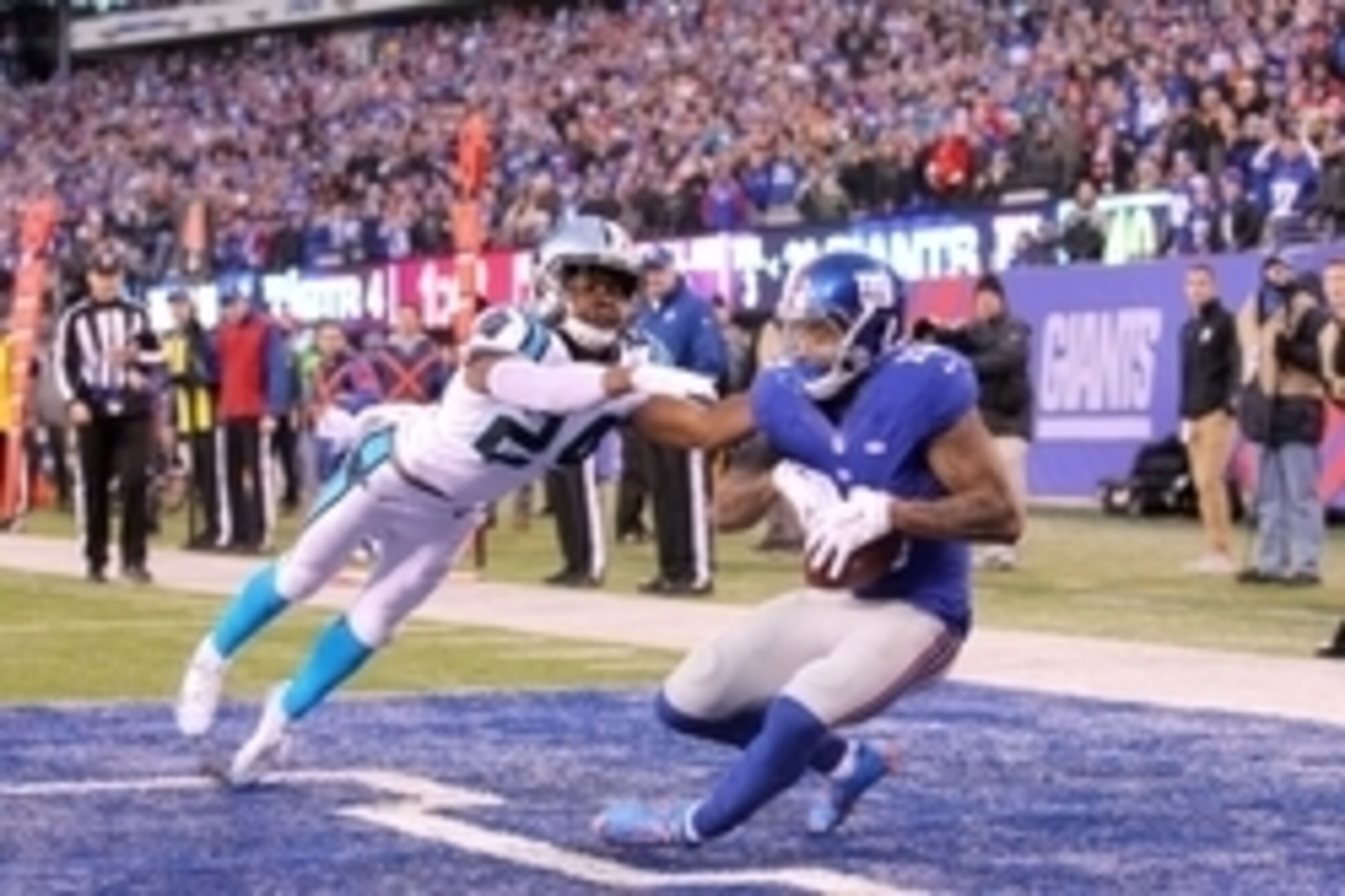 Dec 20, 2015; East Rutherford, NJ, USA; New York Giants wide receiver Odell Beckham Jr. (13) catches a touchdown pass in front of Carolina Panthers corner back Josh Norman (24) during the fourth quarter at MetLife Stadium. The Panthers defeated the Giants