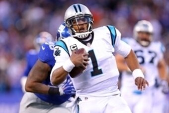 Dec 20, 2015; East Rutherford, NJ, USA; Carolina Panthers quarterback Cam Newton (1) runs with the ball against the New York Giants during the fourth quarter at MetLife Stadium. The Panthers defeated the Giants 38-35. Mandatory Credit: Brad Penner-USA TOD