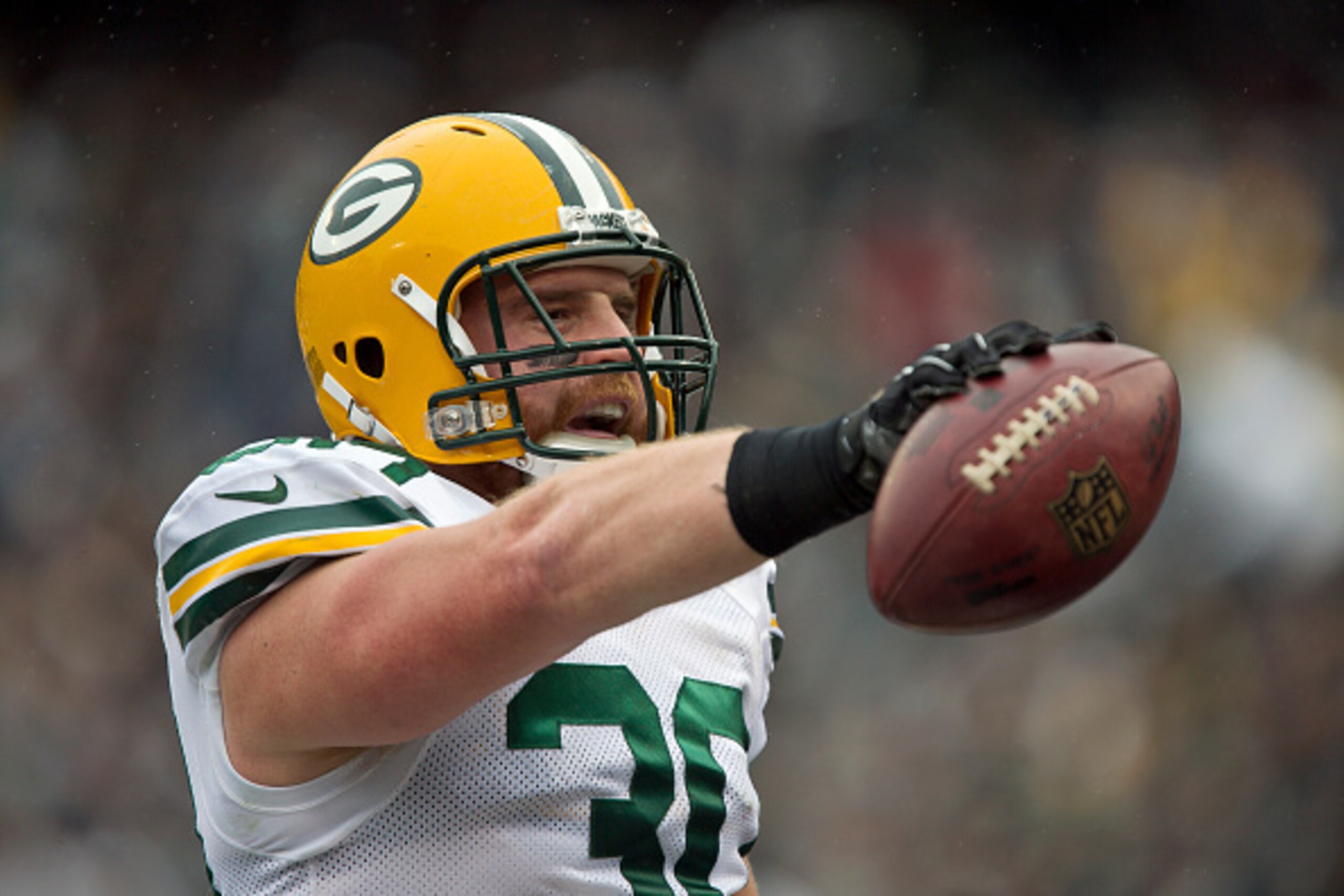OAKLAND, CA - DECEMBER 20: Fullback John Kuhn #30 of the Green Bay Packers celebrates a touchdown against the Oakland Raiders in the first quarter on December 20, 2015 at O.co Coliseum in Oakland, California. (Photo by Brian Bahr/Getty Images)