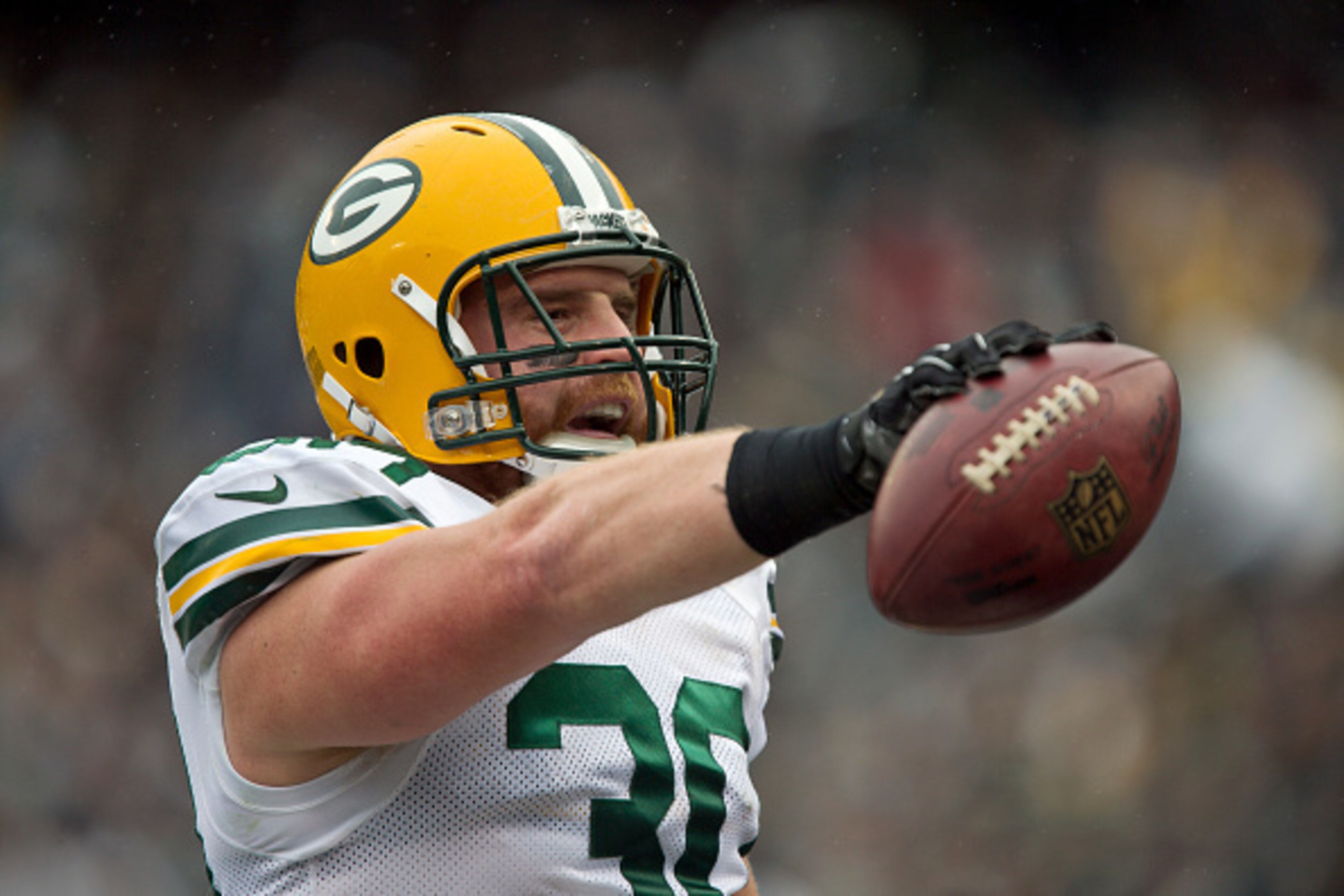 OAKLAND, CA - DECEMBER 20: Fullback John Kuhn #30 of the Green Bay Packers celebrates a touchdown against the Oakland Raiders in the first quarter on December 20, 2015 at O.co Coliseum in Oakland, California. (Photo by Brian Bahr/Getty Images) OAKLAND, CA - DECEMBER 20: Fullback John Kuhn #30 of the Green Bay Packers celebrates a touchdown against the Oakland Raiders in the first quarter on December 20, 2015 at O.co Coliseum in Oakland, California. (Photo by Brian Bahr/Getty Images)