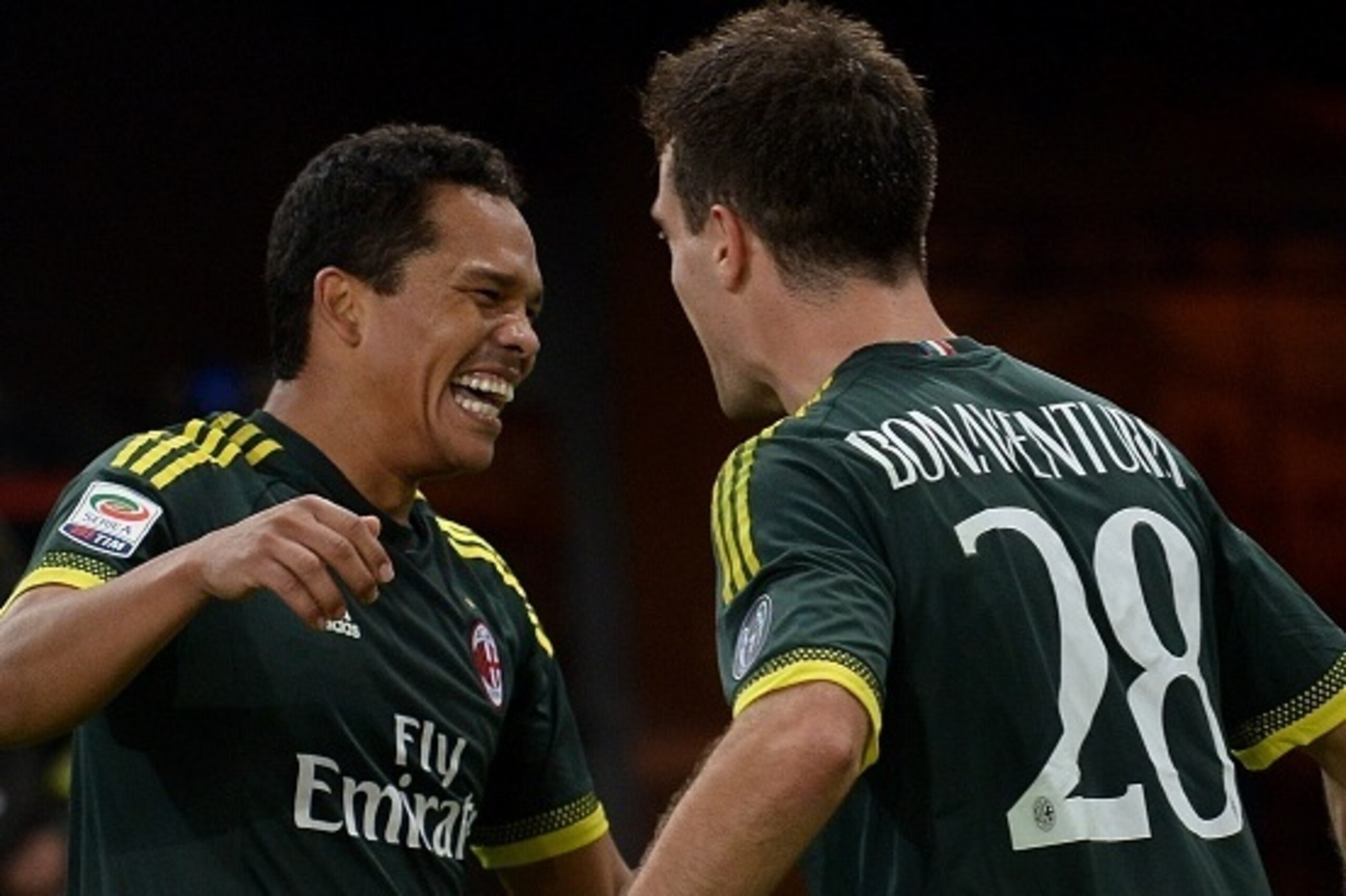 AC Milan's forward from Colombia Carlos Bacca (L) celebrates with teammate AC Milan's midfielder from Italy Giacomo Bonaventura after scoring during the Italian Serie A football match between Lazio and AC Milan at Olympic Stadium in Rome on November 1, 20