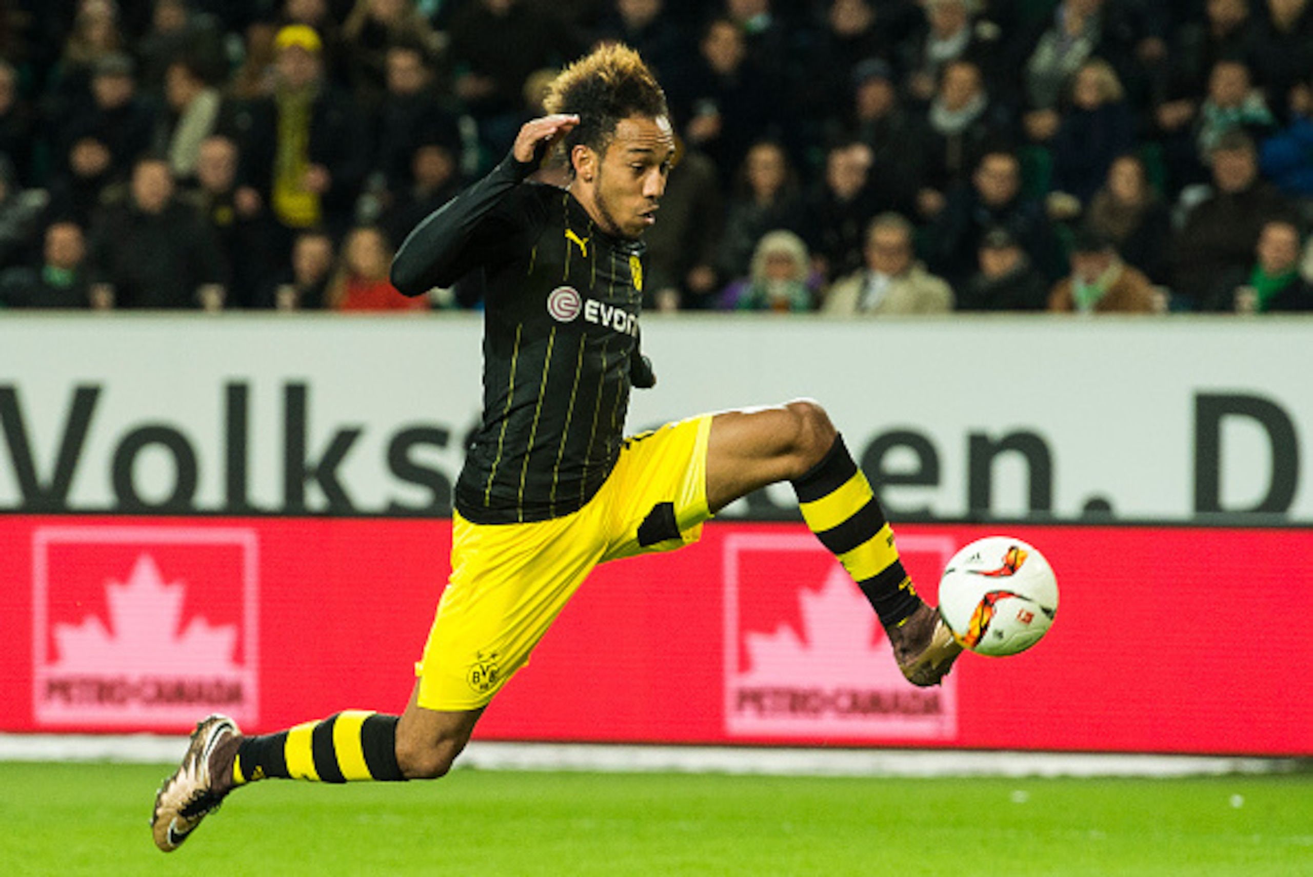 Dortmund's Gabonese midfielder Pierre-Emerick Aubameyang controls the ball during the German first division Bundesliga football match Wolfsburg vs Dortmund in Wolfsburg on December 5, 2015.  
 / AFP / ODD ANDERSEN        (Photo credit should read ODD ANDE