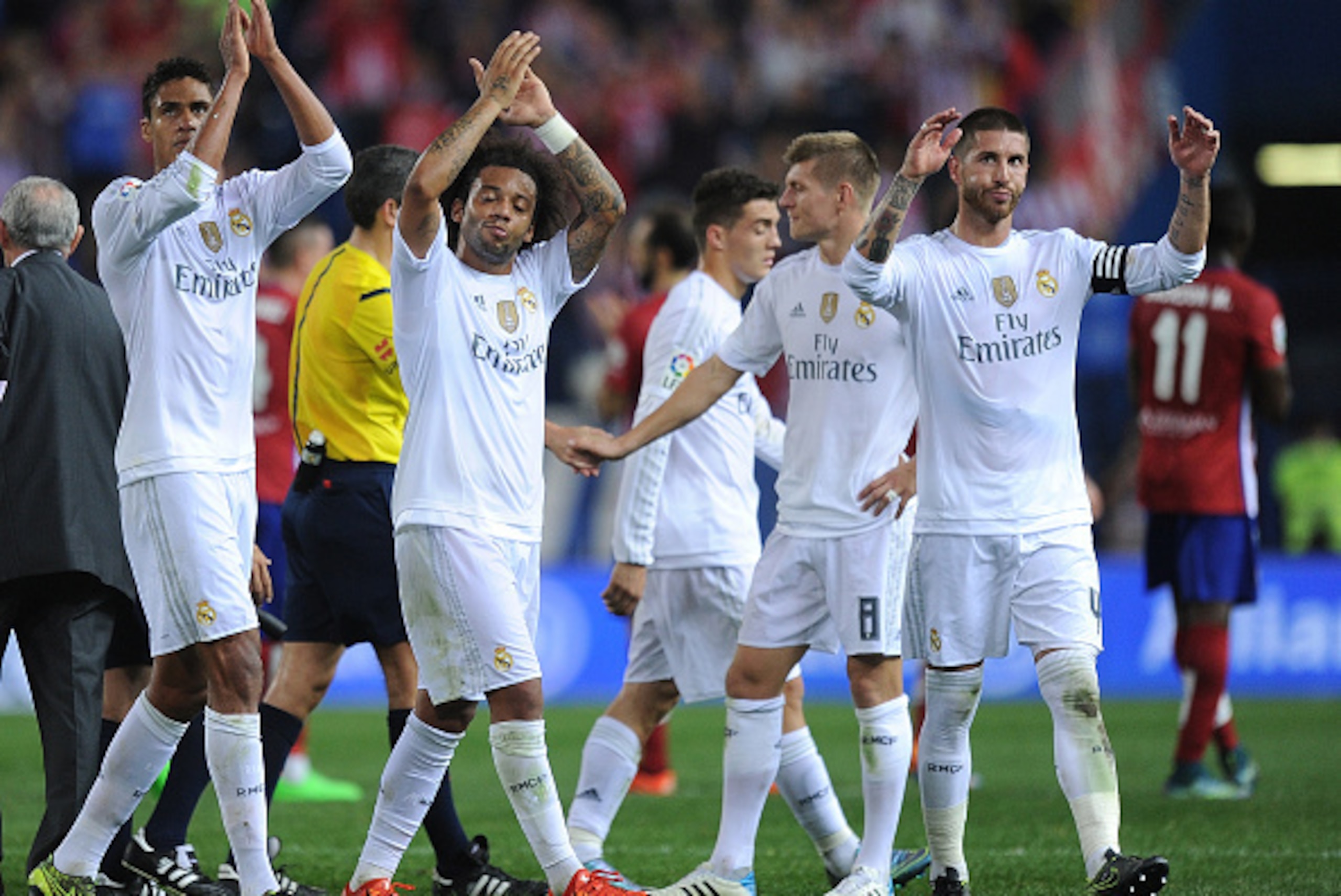 MADRID, SPAIN - OCTOBER 04:   Sergio Ramos and Marcelo of Real Madrid applaud Real fans after they drew 1-1 in the La Liga match between Club Atletico de Madrid and Real Madrid at Vicente Calderon Stadium on October 4, 2015 in Madrid, Spain.  (Photo by De
